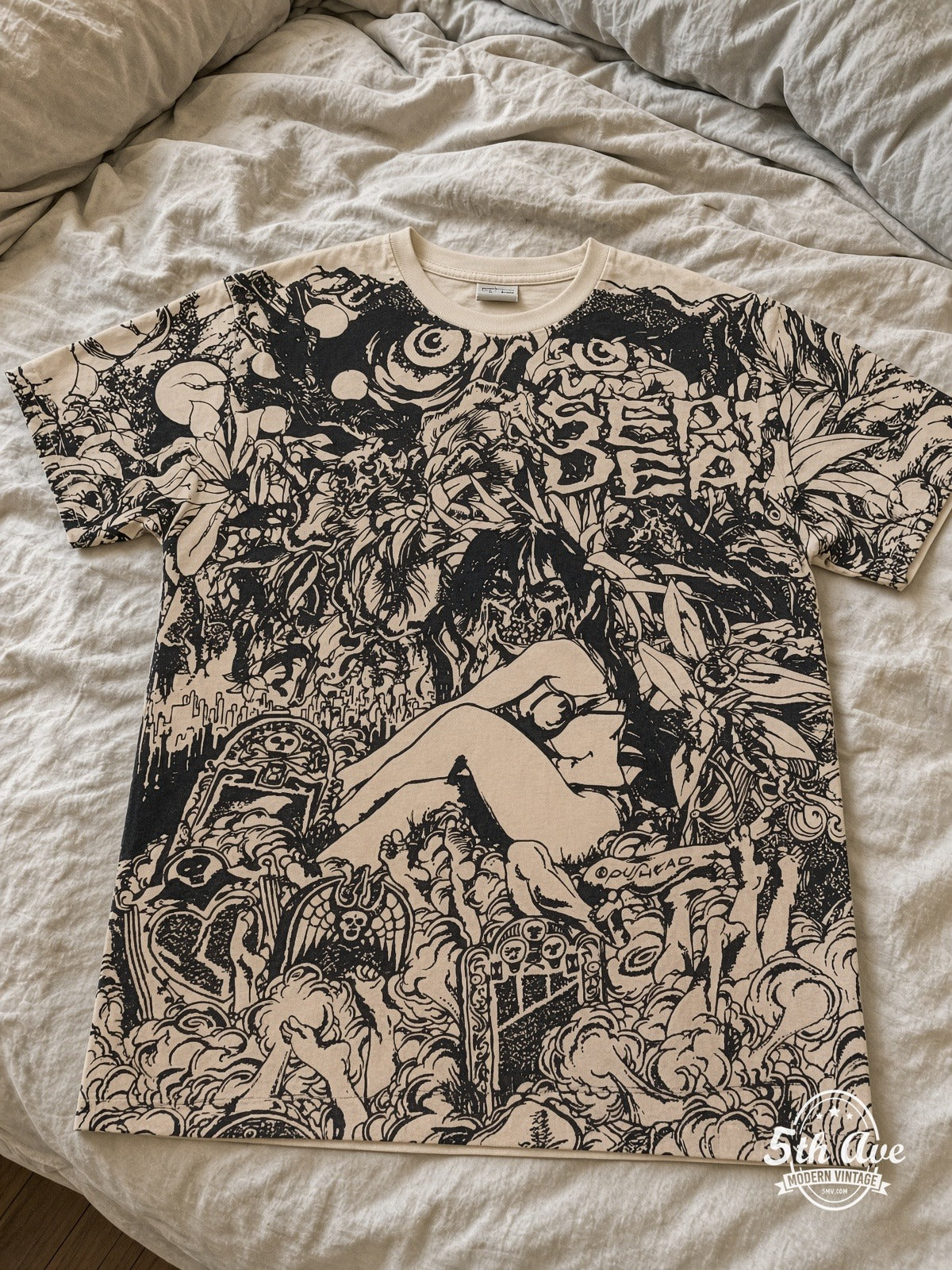 Grateful Dead Skeleton Roses all over print vintage tee laid on bed