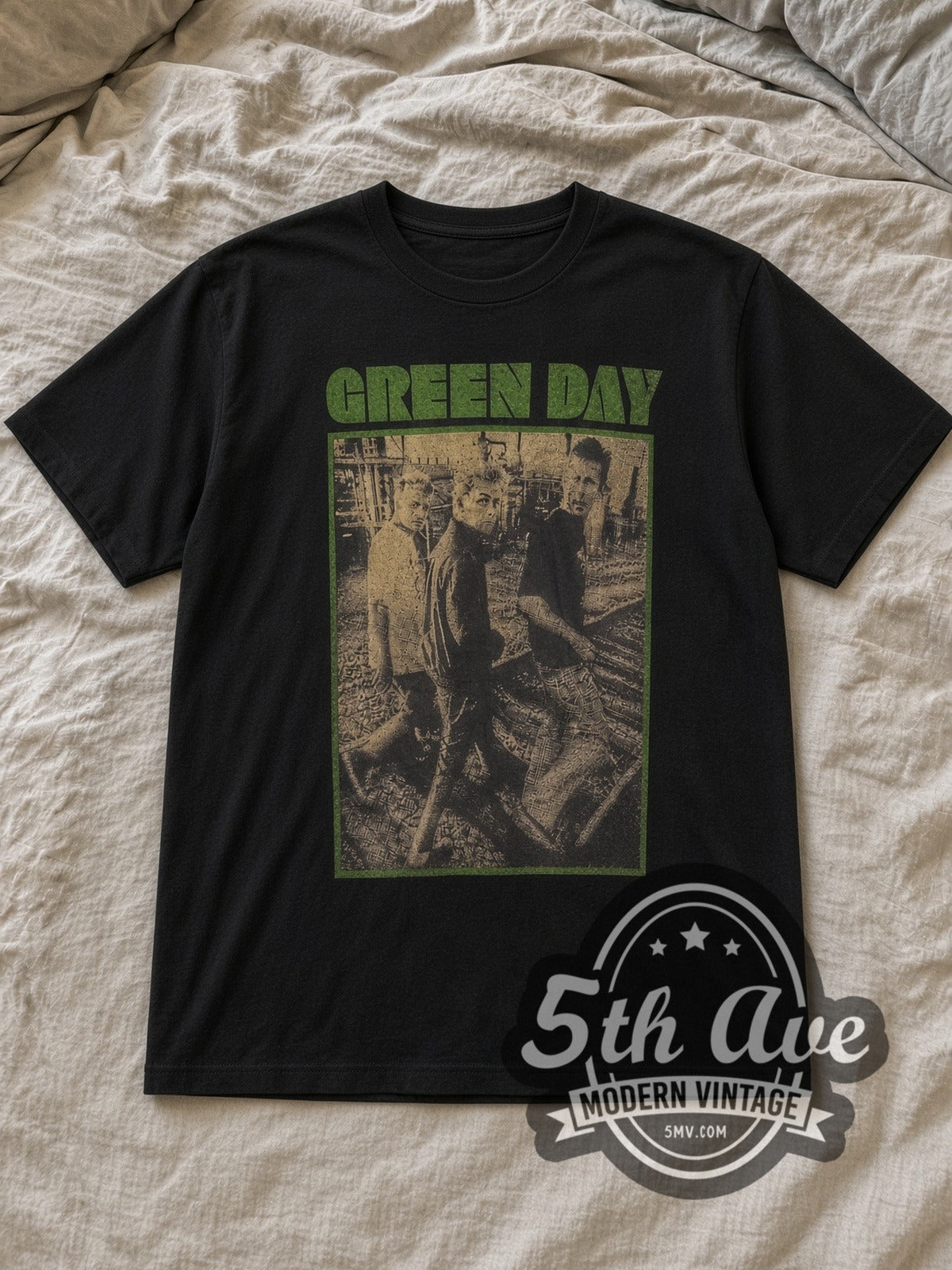 Black Green Day Green Frame Trio Band Photo Vintage Band T-Shirt laid flat on a linen bed