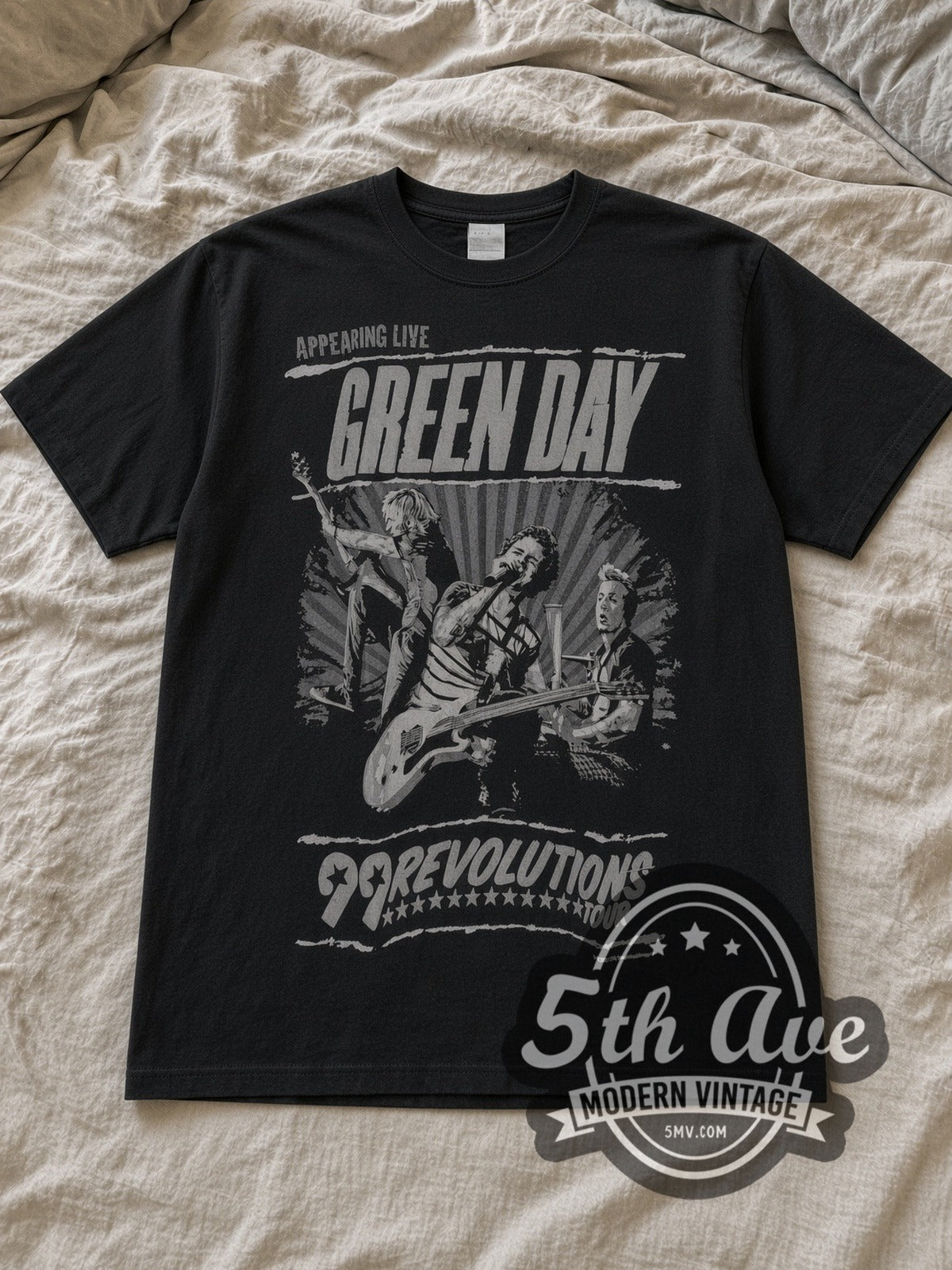 Black Green Day 99 Revolutions Tour Vintage Band T-Shirt laid flat on a linen bed