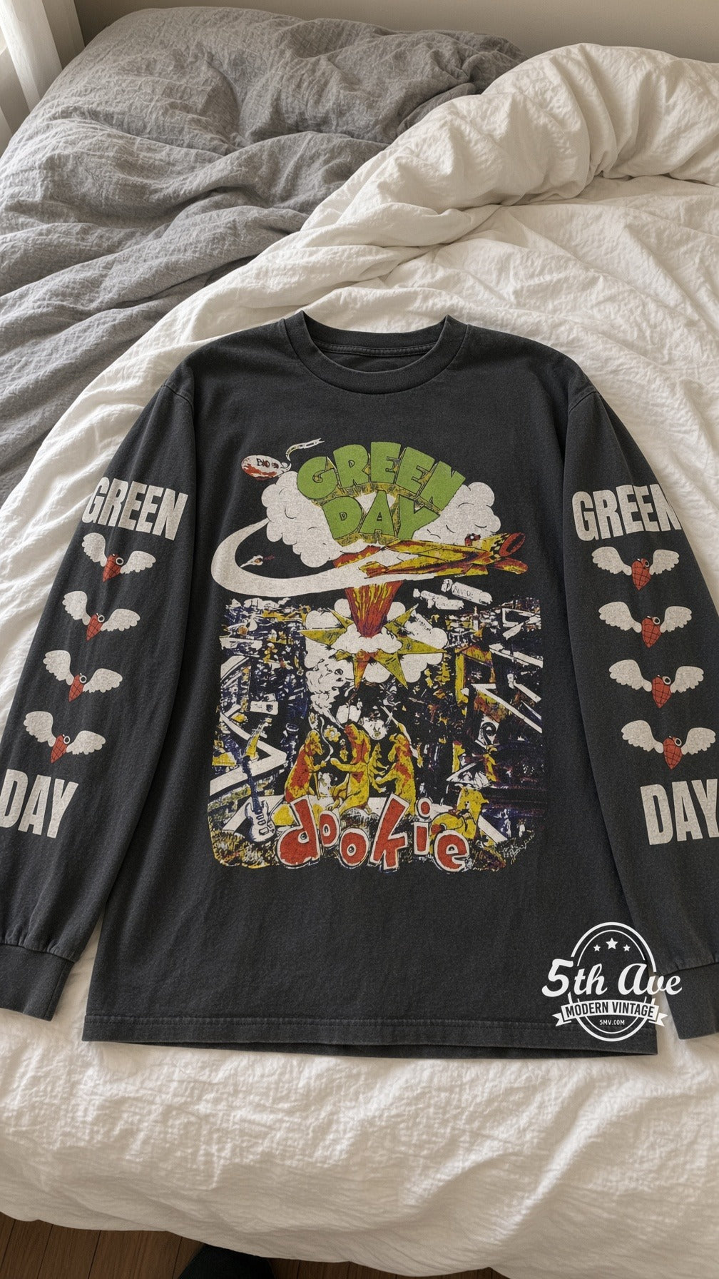 Green Day Dookie World Tour 1994 vintage t-shirt laid on bed