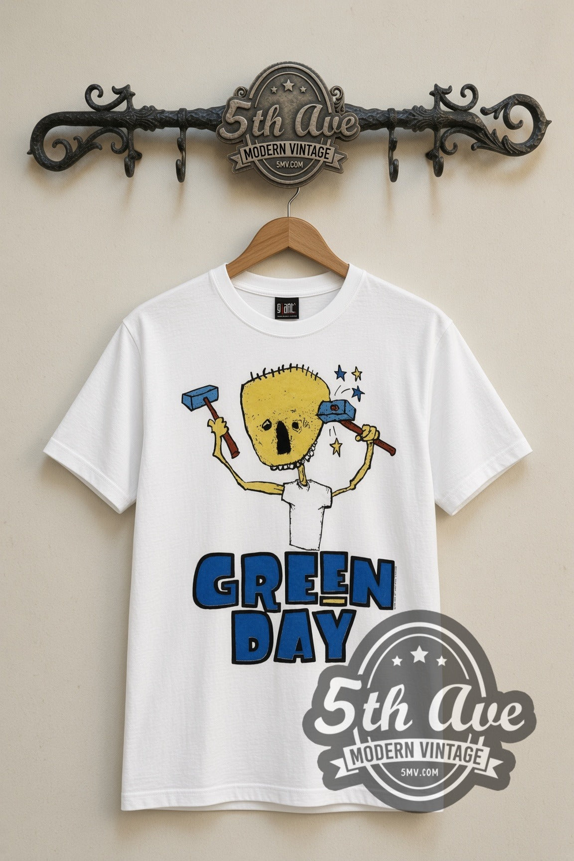 Green Day Nimrod Hammer Skull vintage band t-shirt in white, front view on a display rack