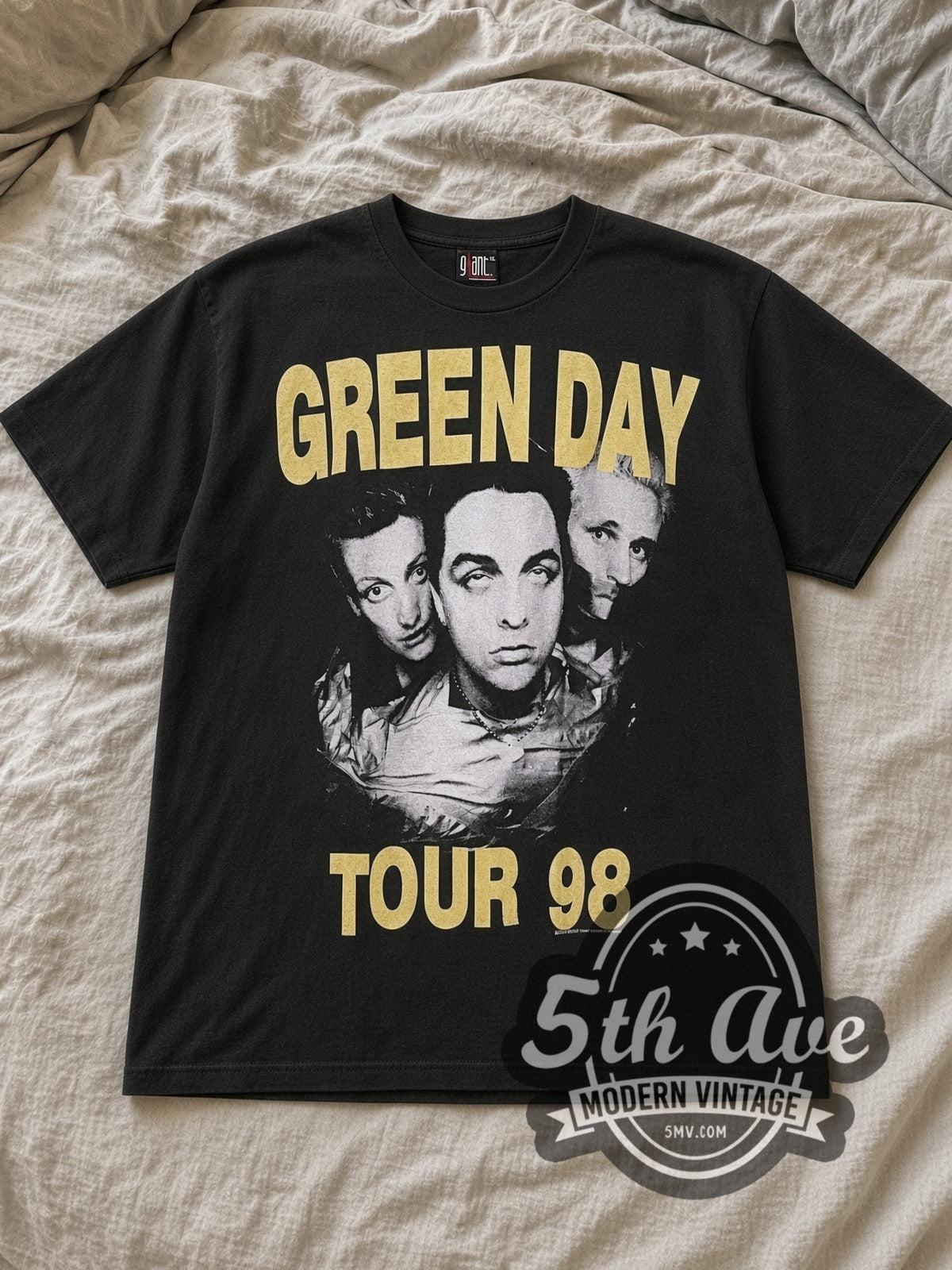Black Green Day Nimrod Tour T Shirt Classic Band Design Vintage Band T-Shirt laid flat on a linen bed