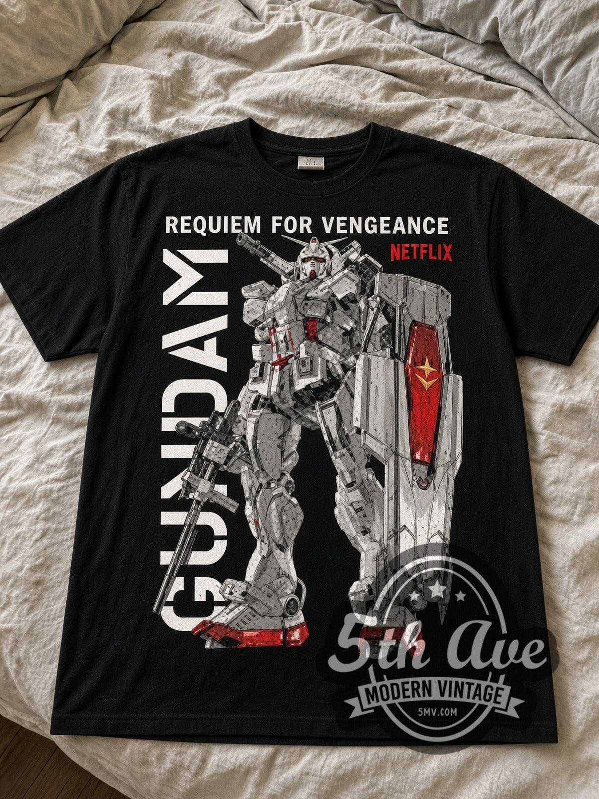 Gundam Requiem for Vengeance black graphic tee laid flat on linen bed