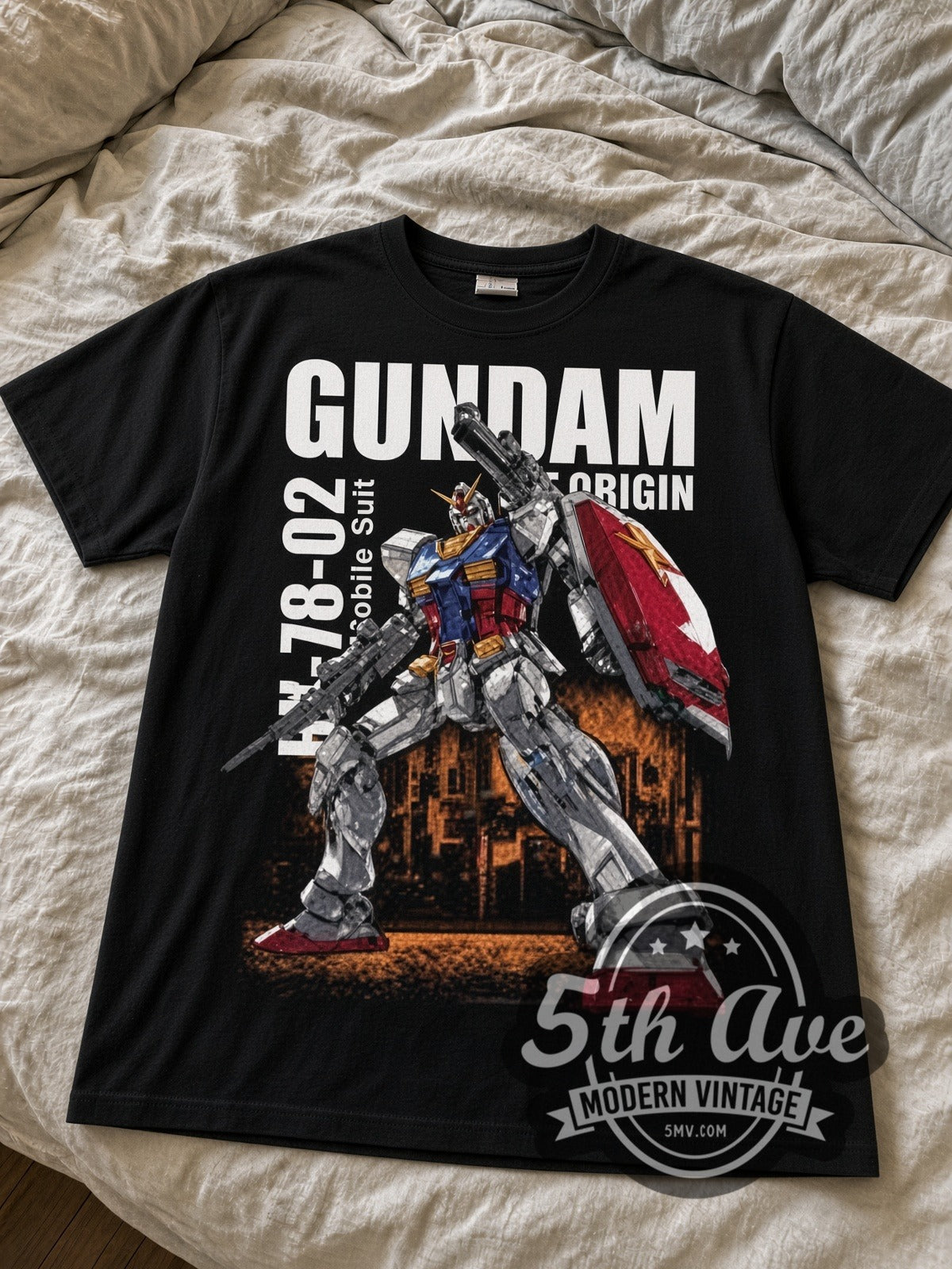 Gundam RX-78-02 The Origin black graphic tee laid flat on linen bed