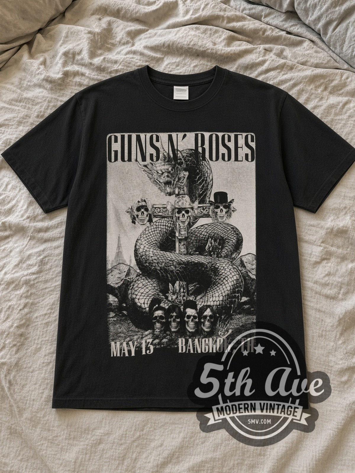 Black Guns N' Roses World Tour Thailand 2025 Vintage Band T-Shirt laid flat on a linen bed