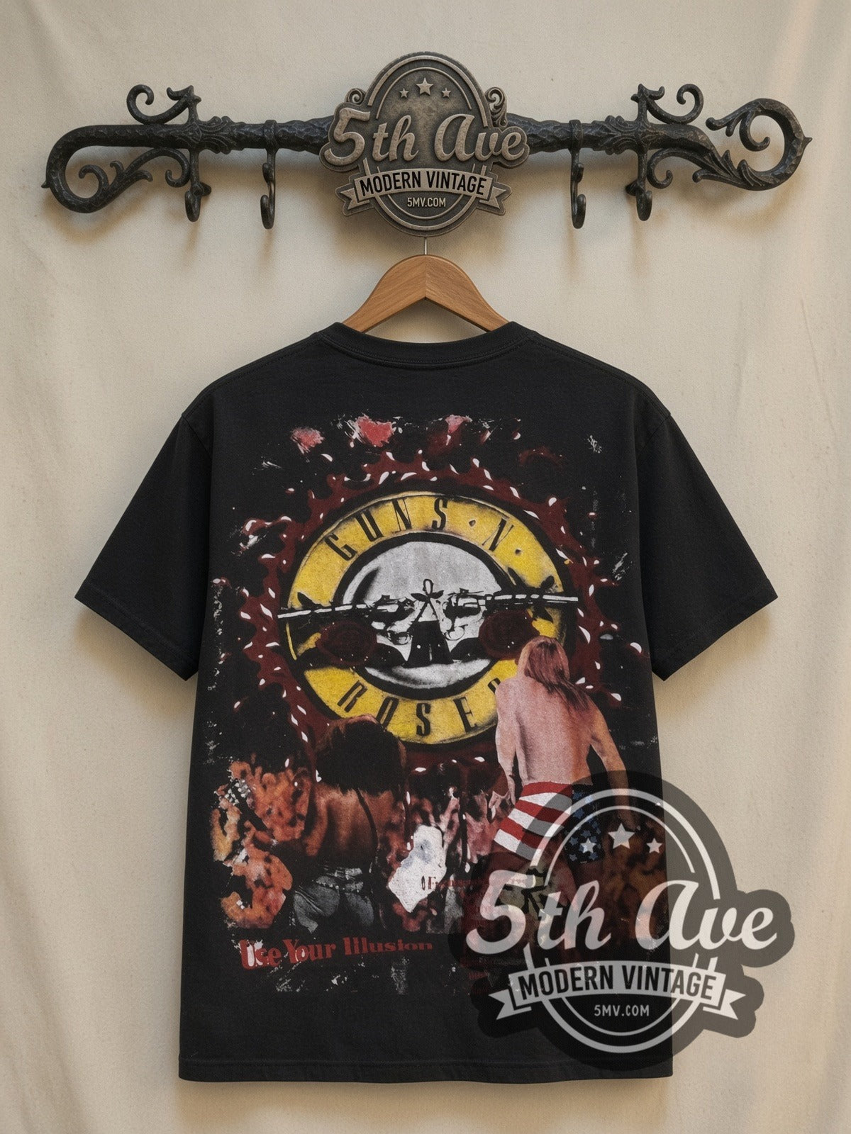 Guns N' Roses Axl Circular Logo all-over-print vintage band t-shirt in black, back view on a display rack