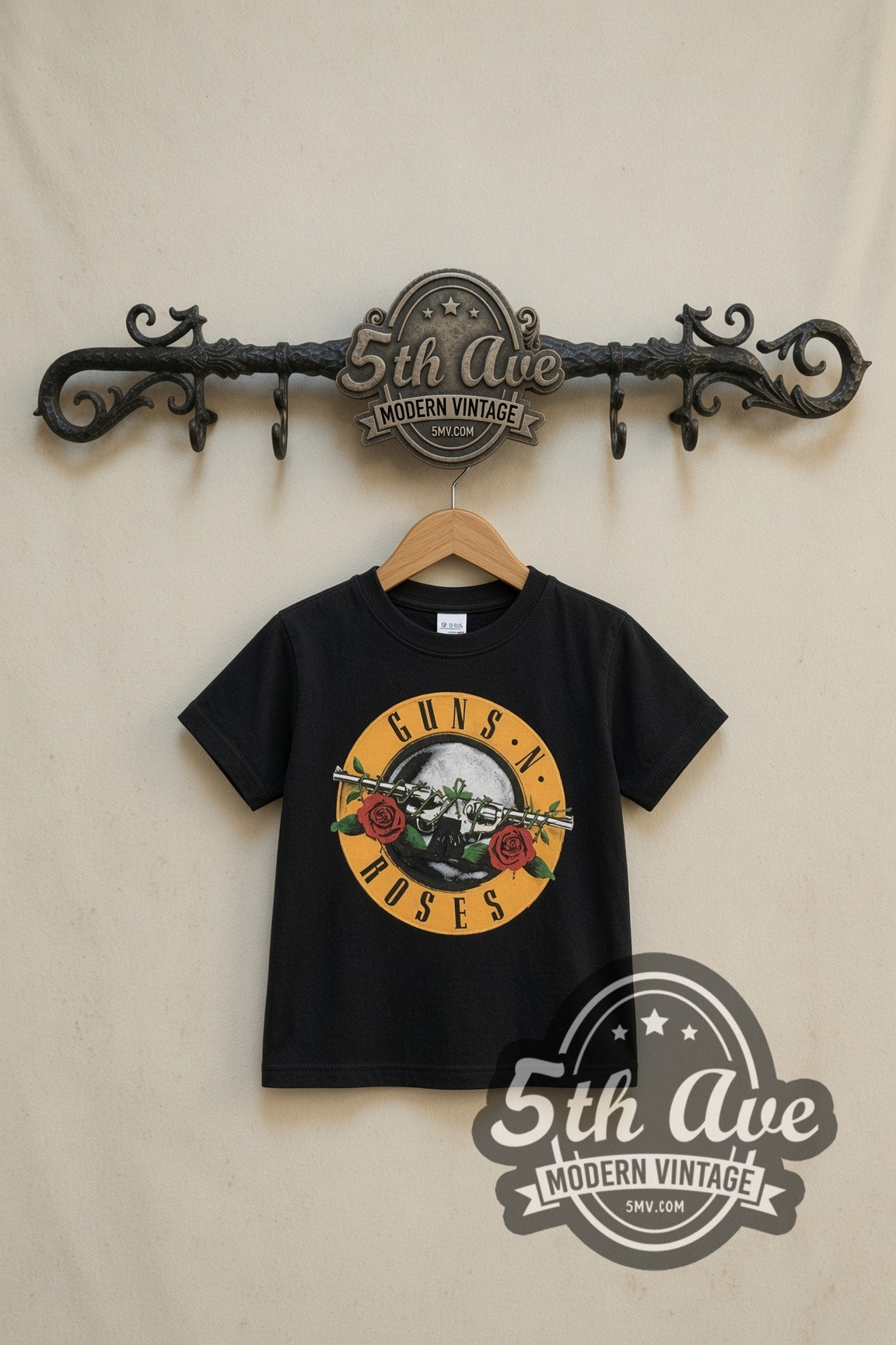Guns N' Roses Bullet Logo Was Here kids band tee in black, front view on a display rack