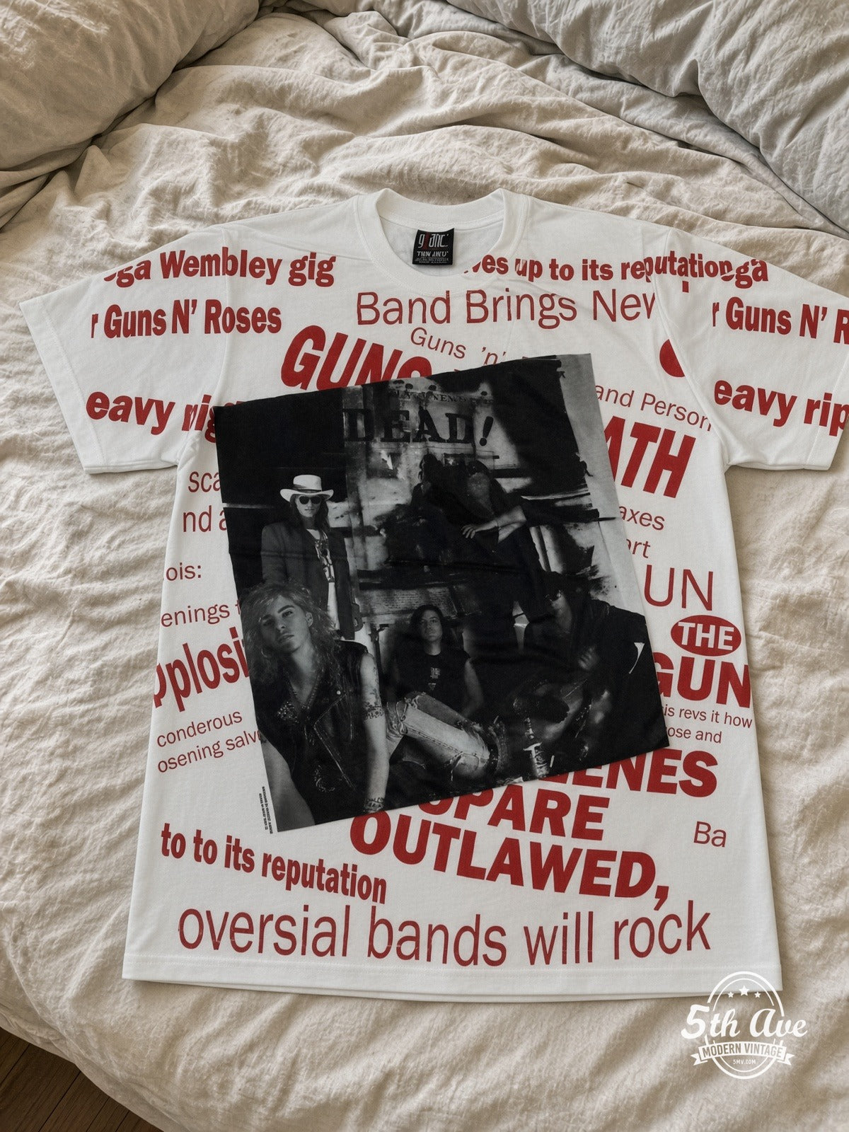 Guns N' Roses Newspaper Outlawed V2 all over print vintage tee laid on bed