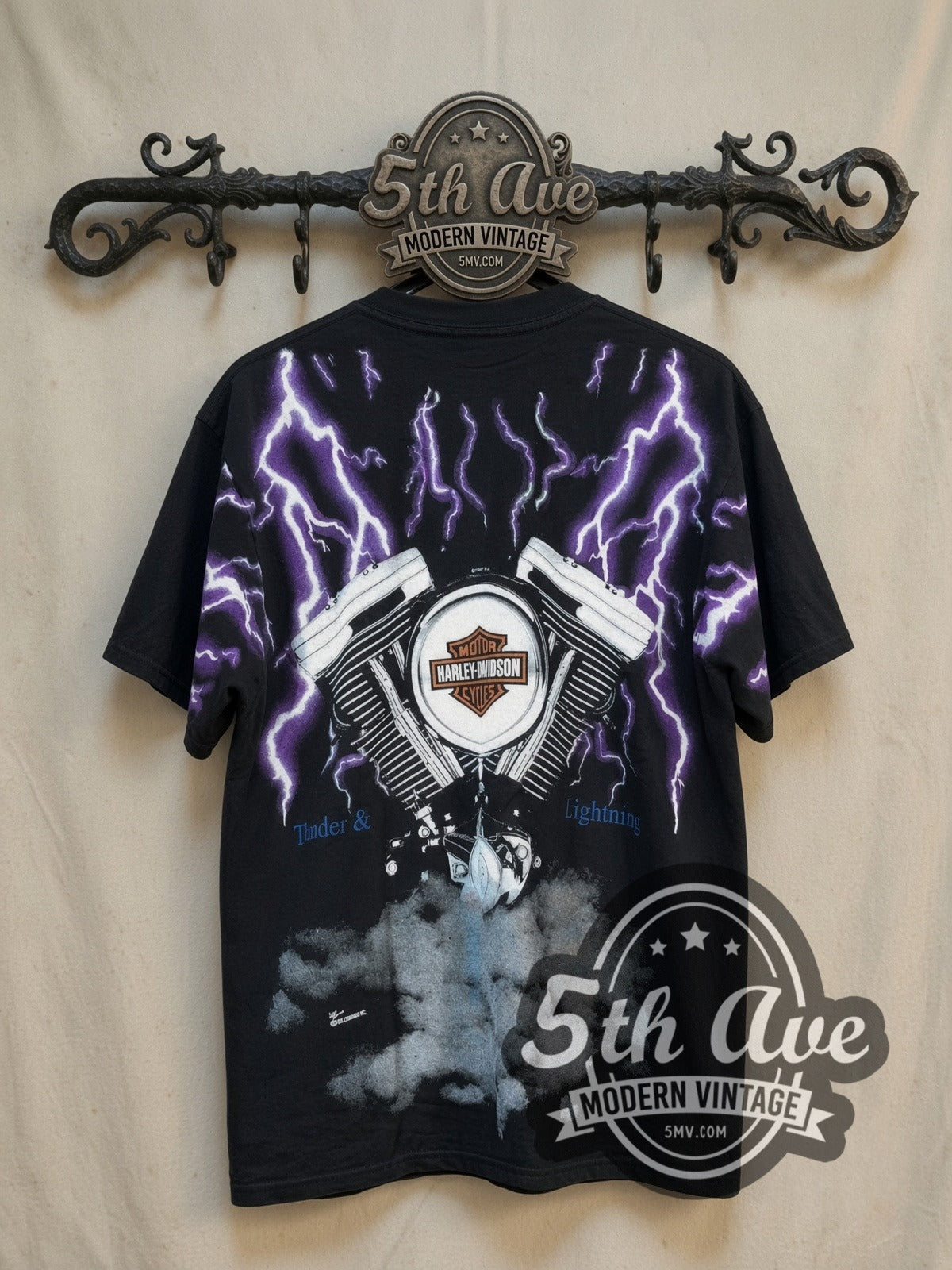 Harley-Davidson Thunder and Lightning Engine all-over-print vintage graphic t-shirt, back view on a display rack