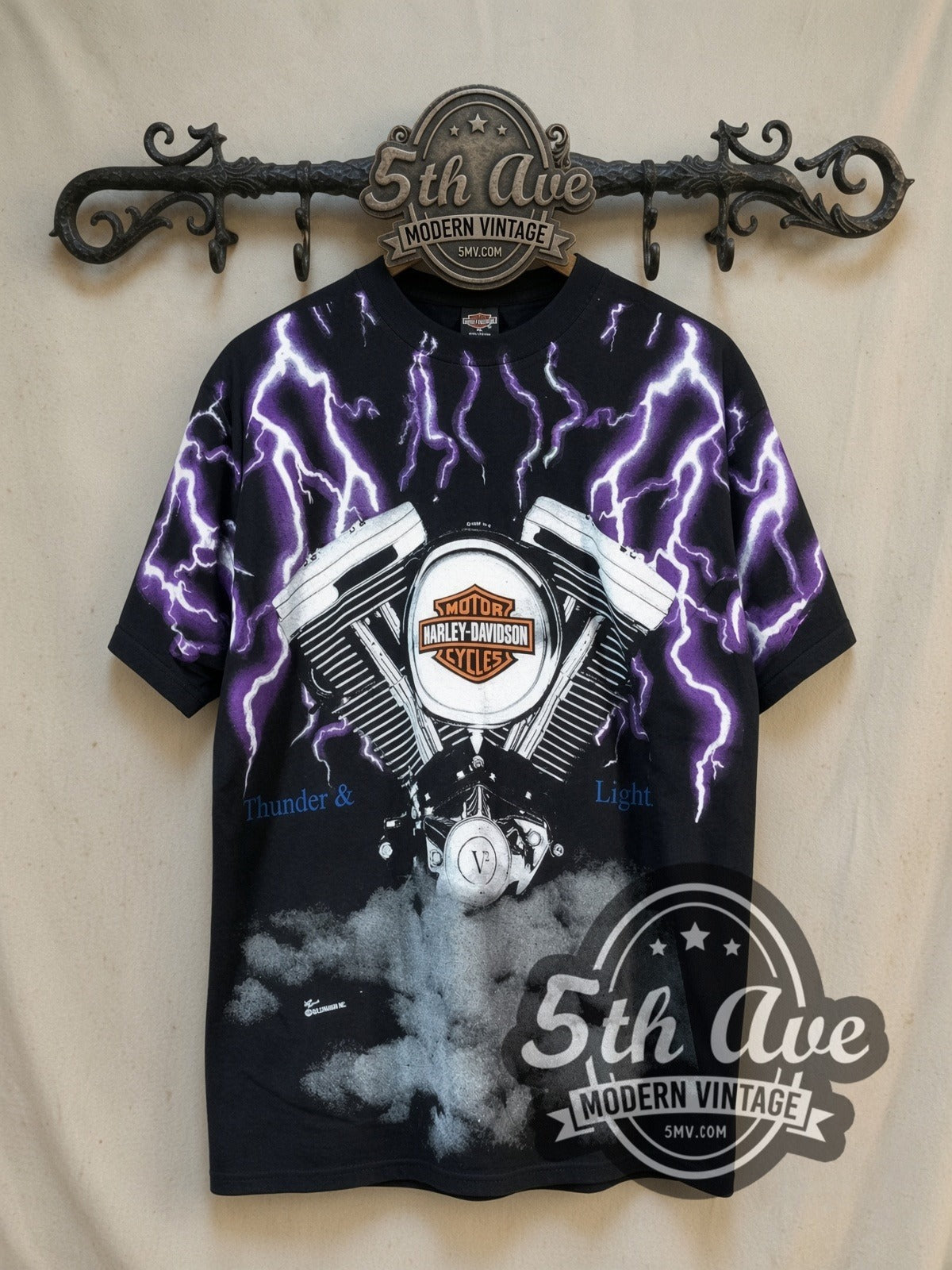 Harley-Davidson Thunder and Lightning Engine all-over-print vintage graphic t-shirt, front view on a display rack