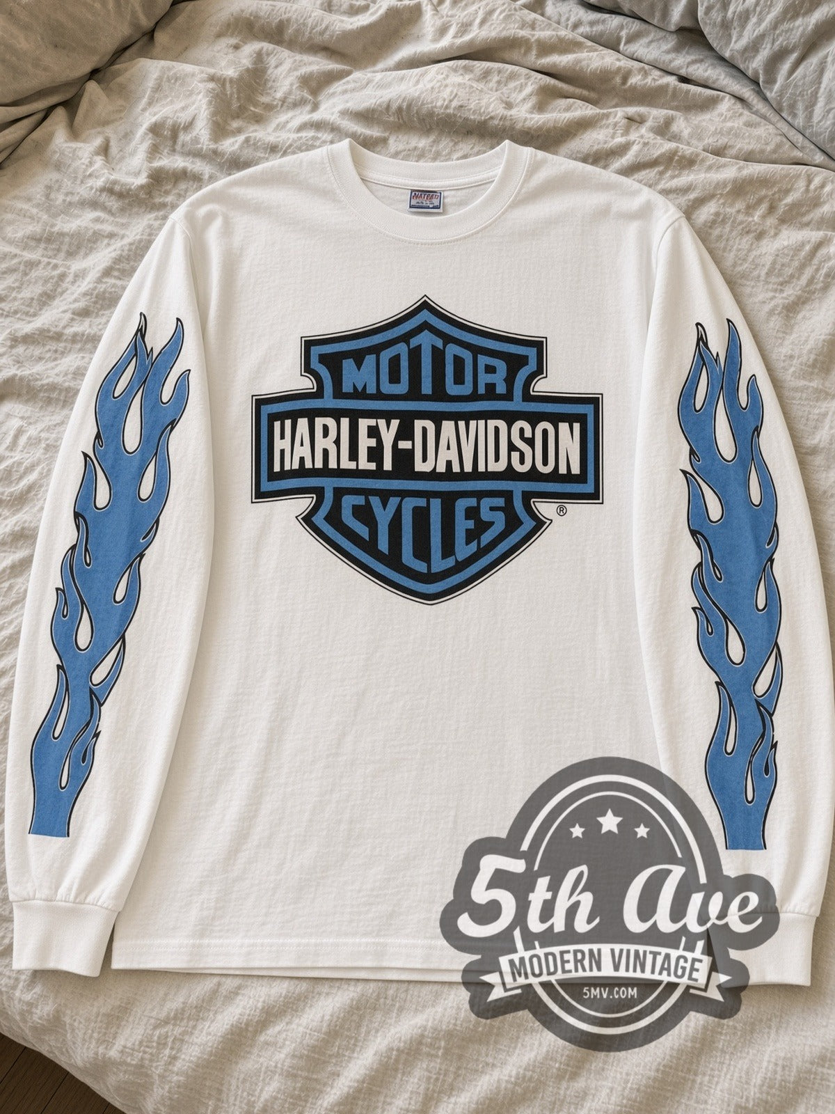 White Harley-Davidson A.D. Farrow long sleeve laid flat on linen bed
