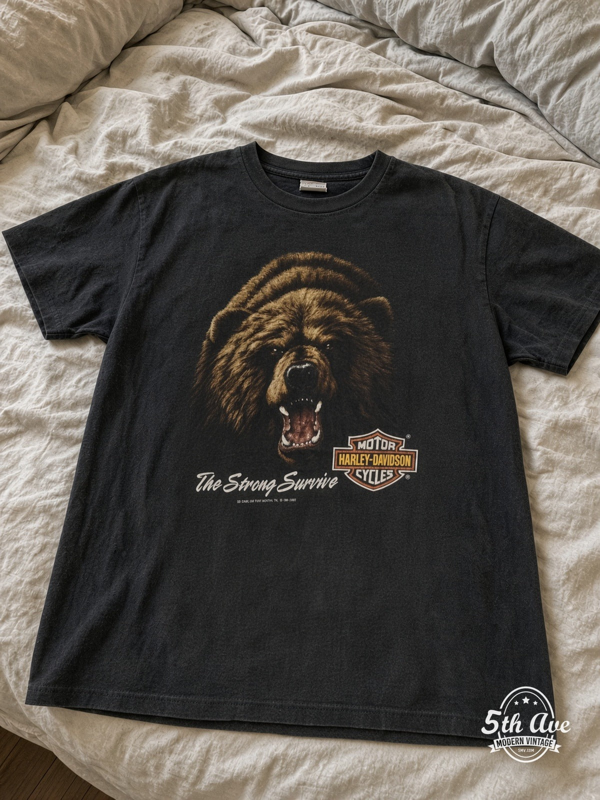 Harley-Davidson Joe's Place The Strong Survive vintage tee laid on bed