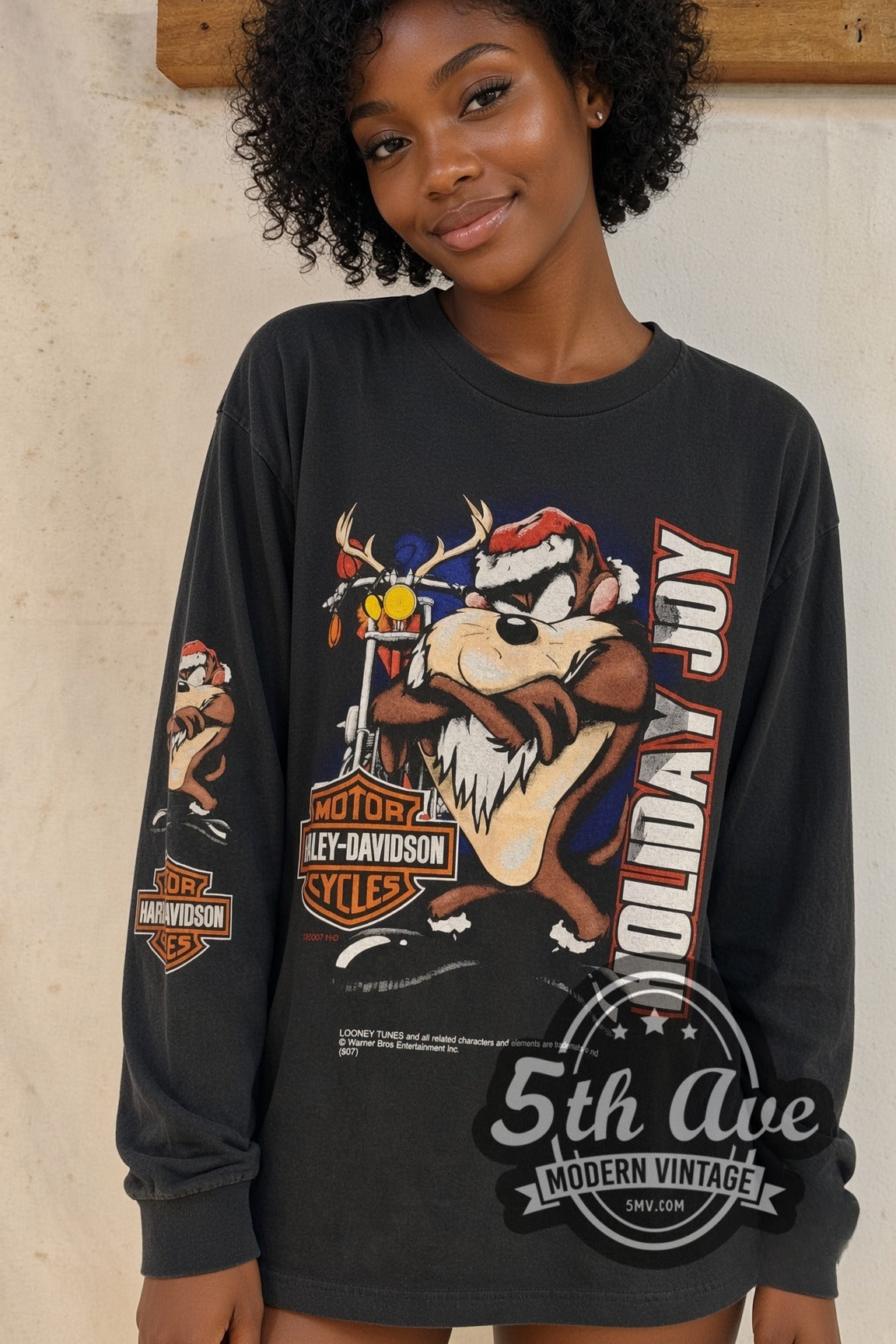Model wearing the Harley-Davidson Looney Tunes Taz Holiday Joy vintage graphic long sleeve t-shirt