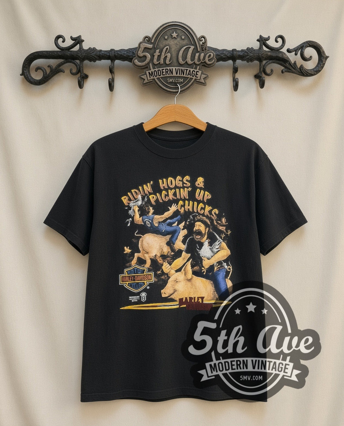 Harley-Davidson Ridin' Hogs Pickin' Up Chicks vintage Harley tee in black, front view on a display rack