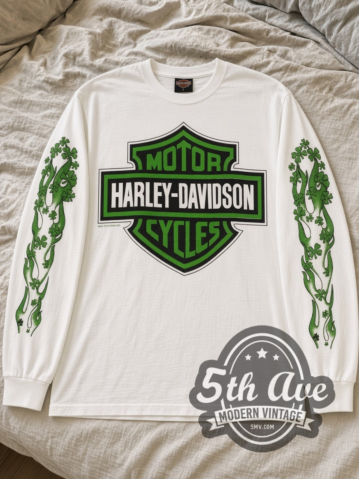 White Harley-Davidson St. Patrick's Day long sleeve laid flat on linen bed