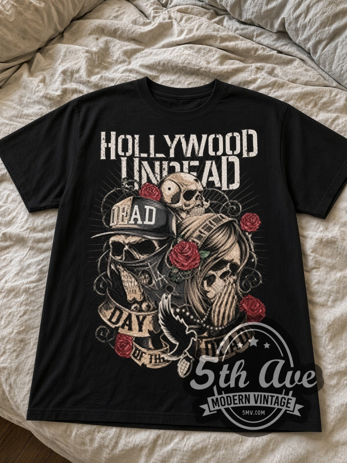 Hollywood Undead Day of the Dead Skulls and Roses black graphic tee laid flat on linen bed