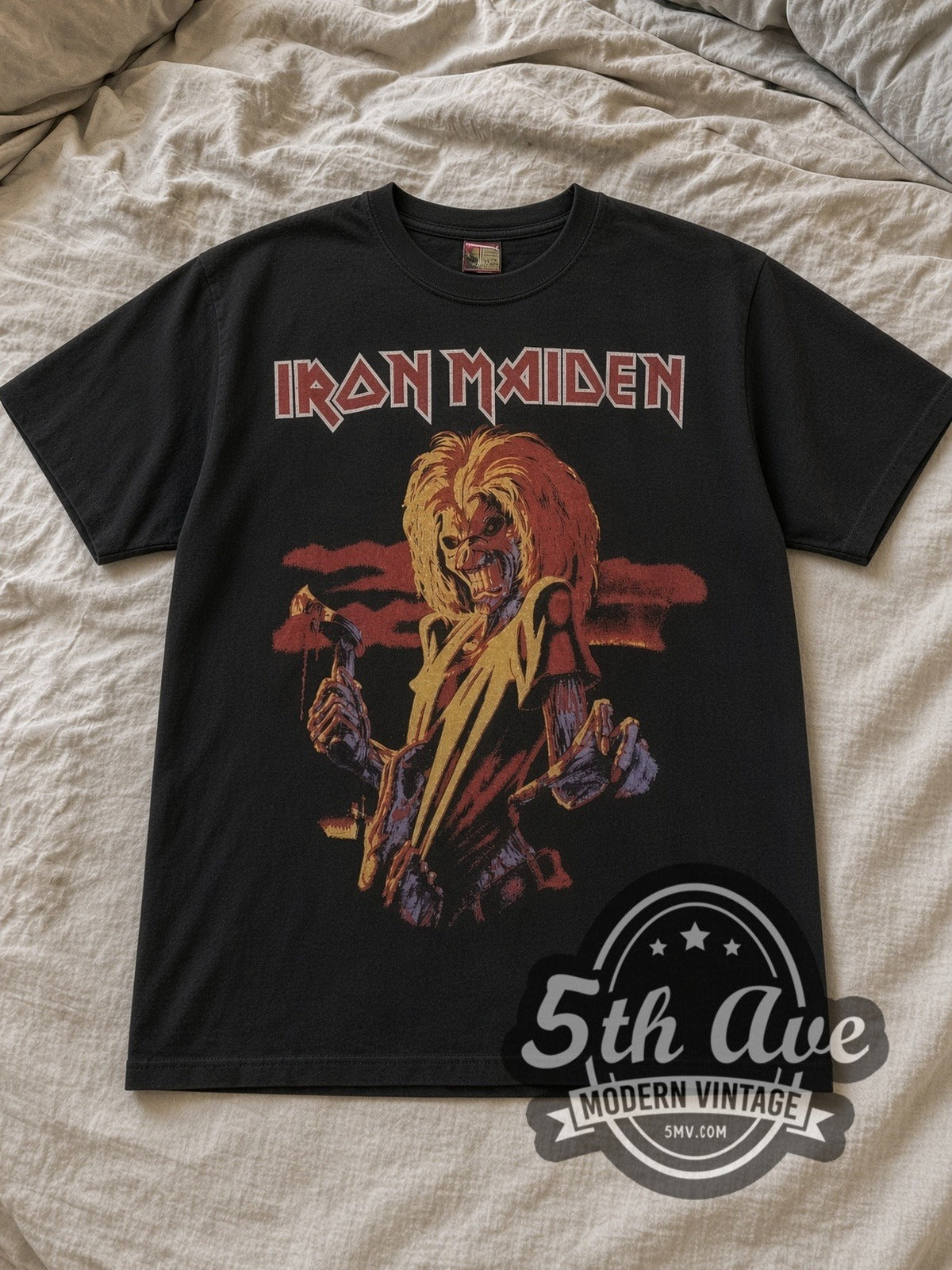 Black Iron Maiden Latin America Tour 1996 Vintage Band T-Shirt laid flat on a linen bed