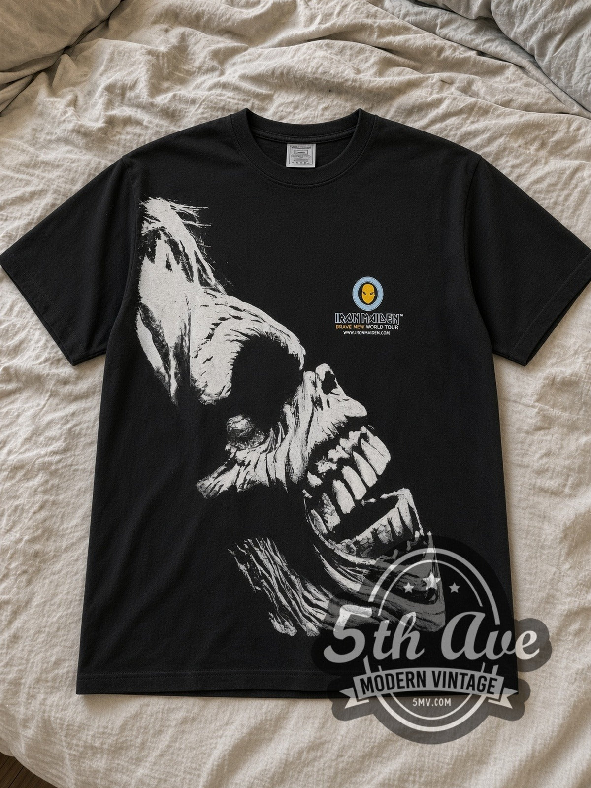Black Iron Maiden Brave New World Tour All Over Print Vintage Band T-Shirt laid flat on a linen bed