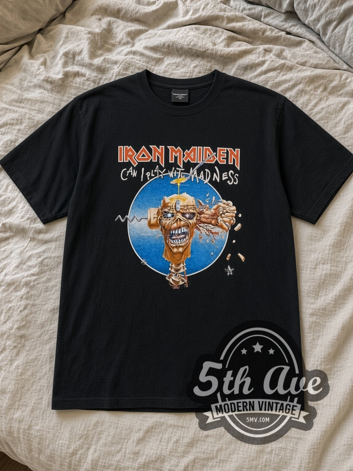 Black Iron Maiden Can I Play With Madness Vintage Band T-Shirt laid flat on a linen bed