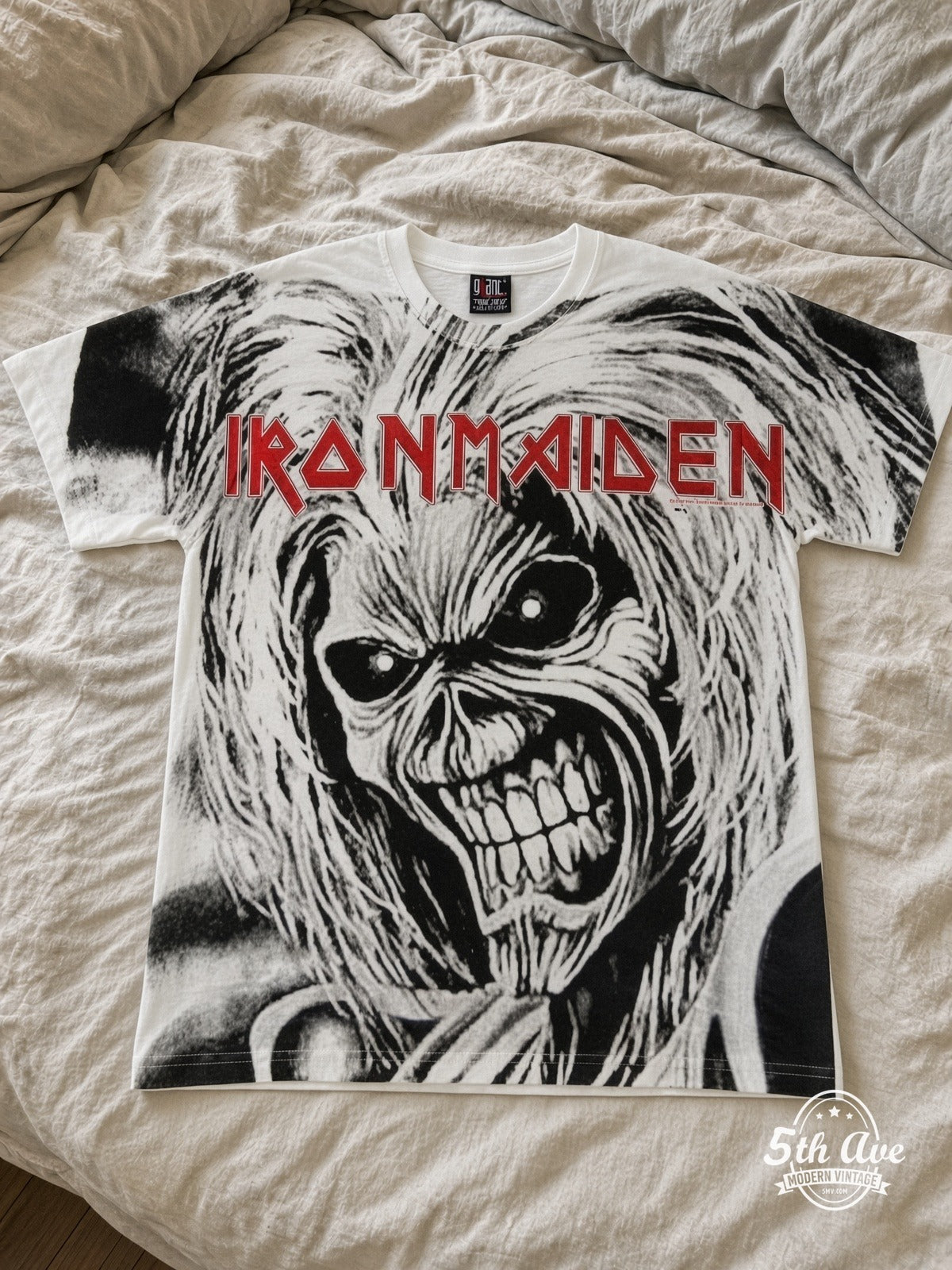 Iron Maiden Eddie Snarl Bloody Hand all over print vintage tee laid on bed