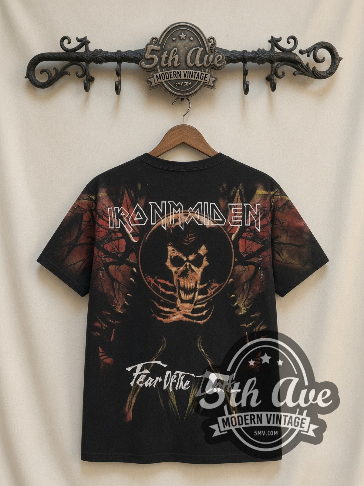 Iron Maiden Fear of the Dark Tree Eddie all-over-print vintage band t-shirt in black, back view on a display rack