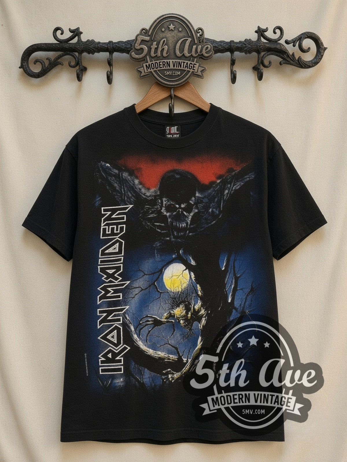 Iron Maiden Fear of the Dark Vertical Wordmark all-over-print vintage band t-shirt, front view on a display rack