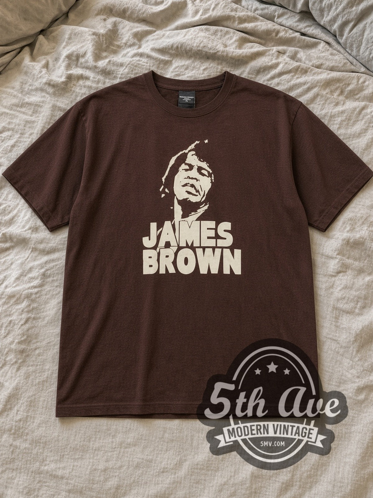 Brown James Brown Vintage Band T-Shirt laid flat on a linen bed
