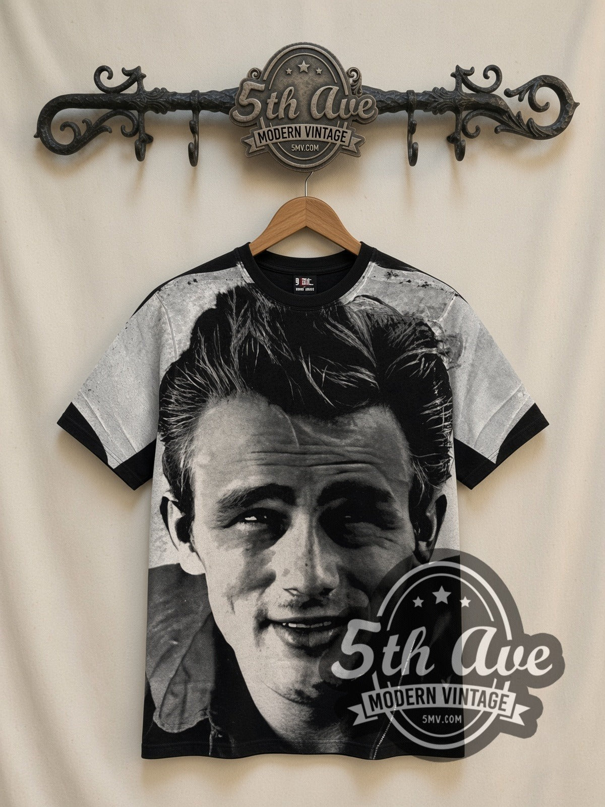James Dean Smile Portrait all-over-print vintage graphic tee in black, front view on a display rack
