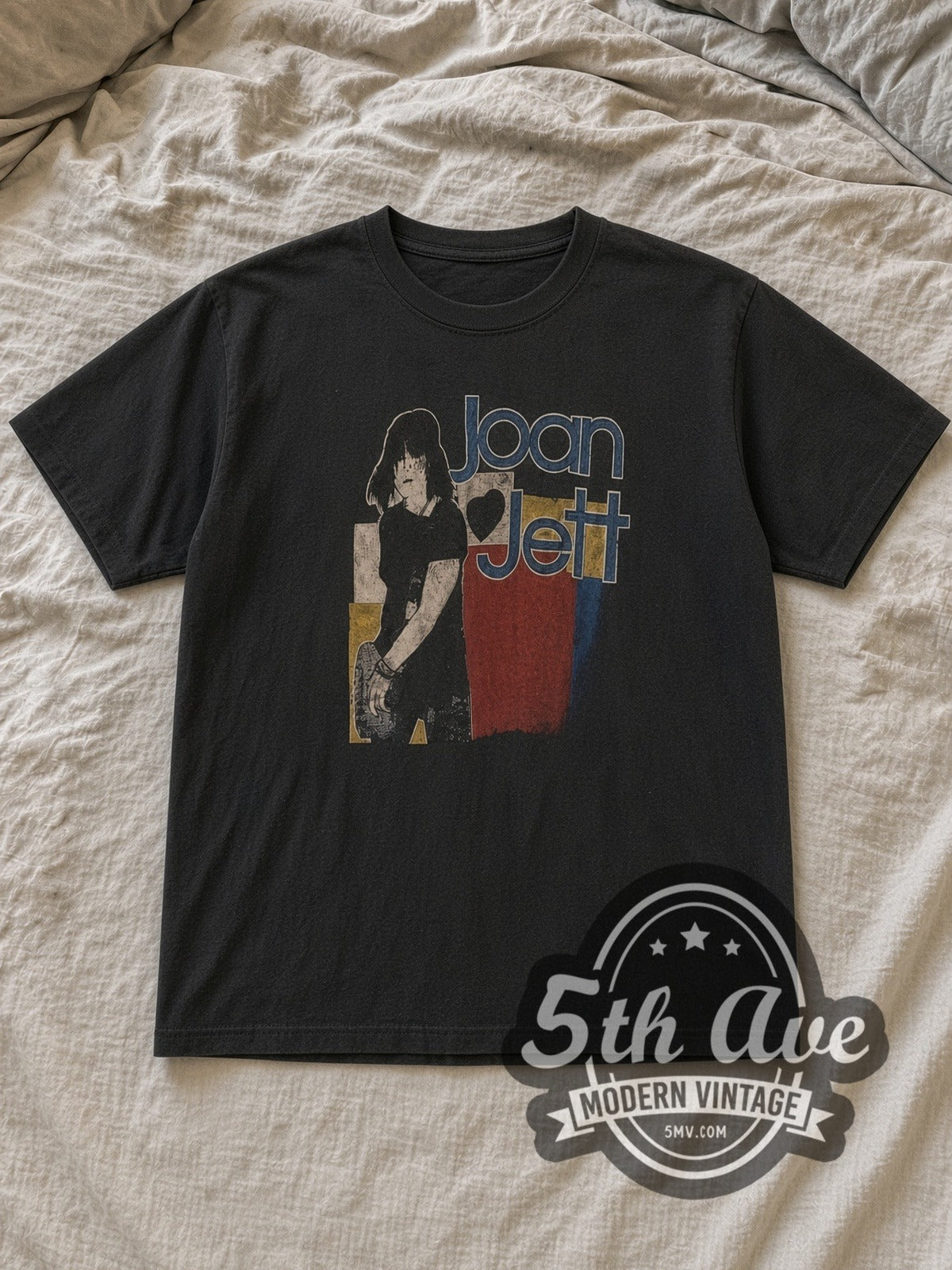 Black Joan Jett Bad Reputation Vintage Band T-Shirt laid flat on a linen bed