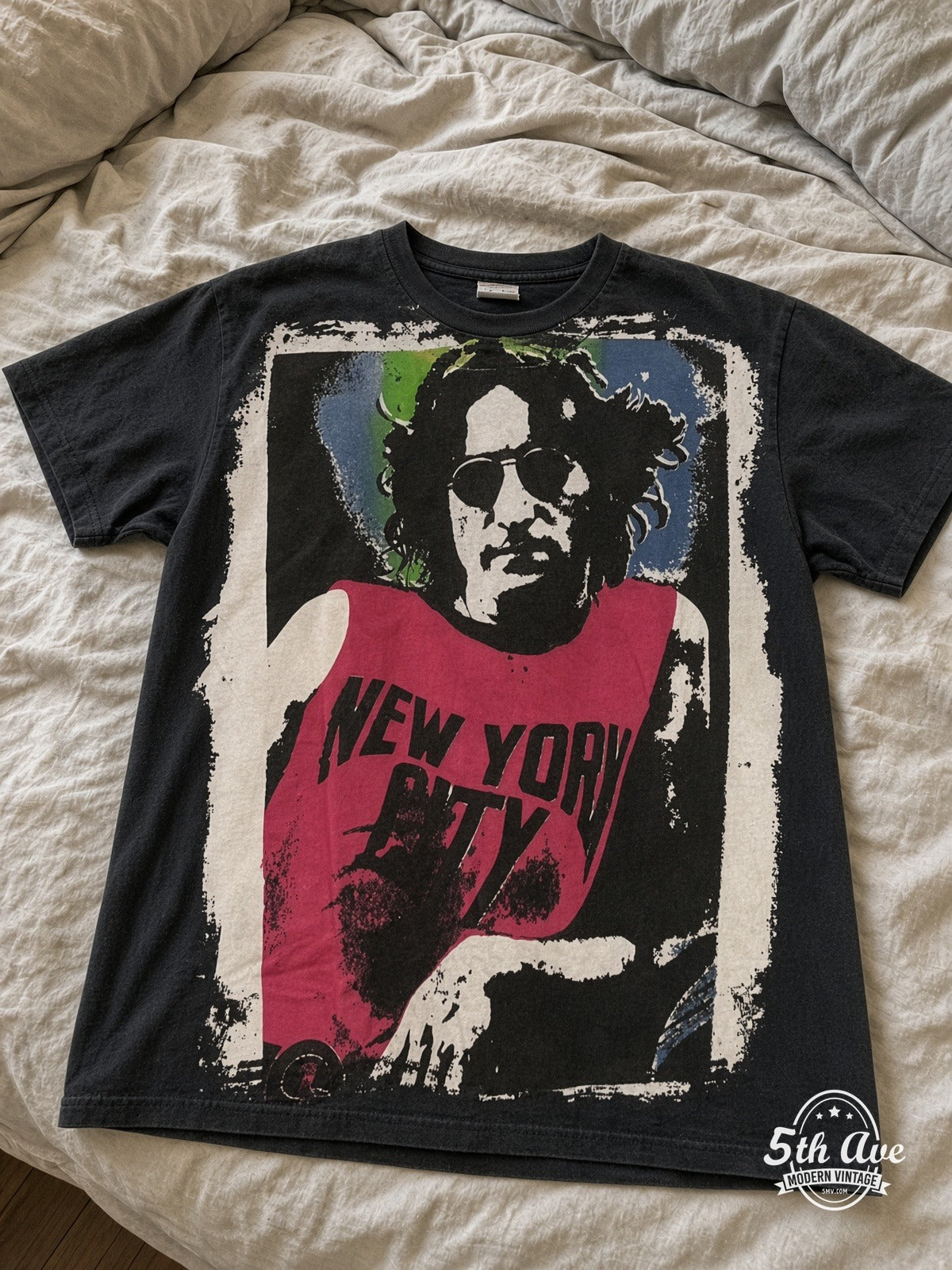 John Lennon NYC Pink Tank vintage tee laid on bed