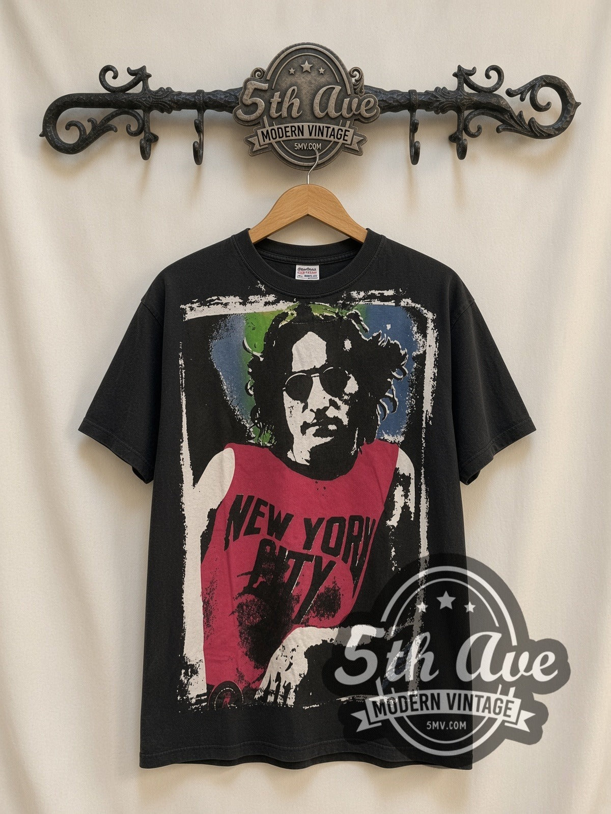 John Lennon NYC Pink Tank vintage band t-shirt, front view on a display rack