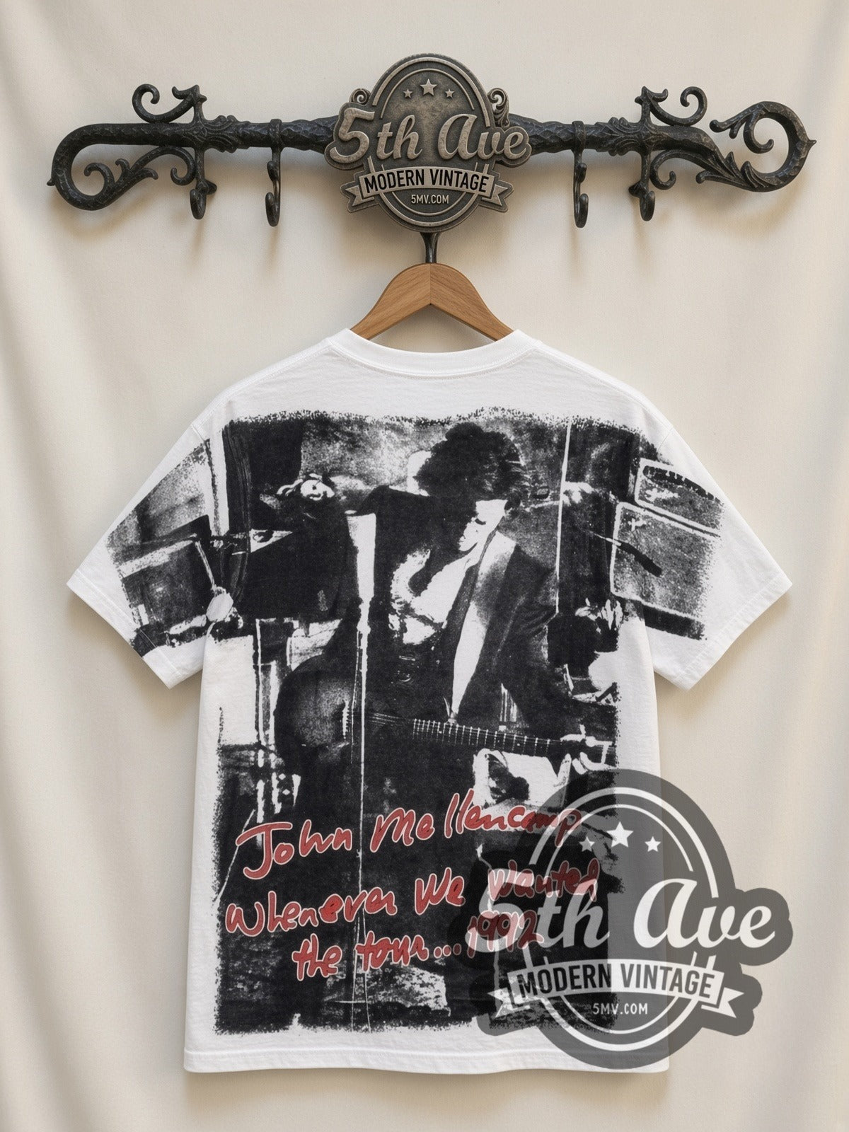 John Mellencamp Whenever We Wanted Tour 1992 all-over-print vintage band t-shirt in white, back view on a display rack