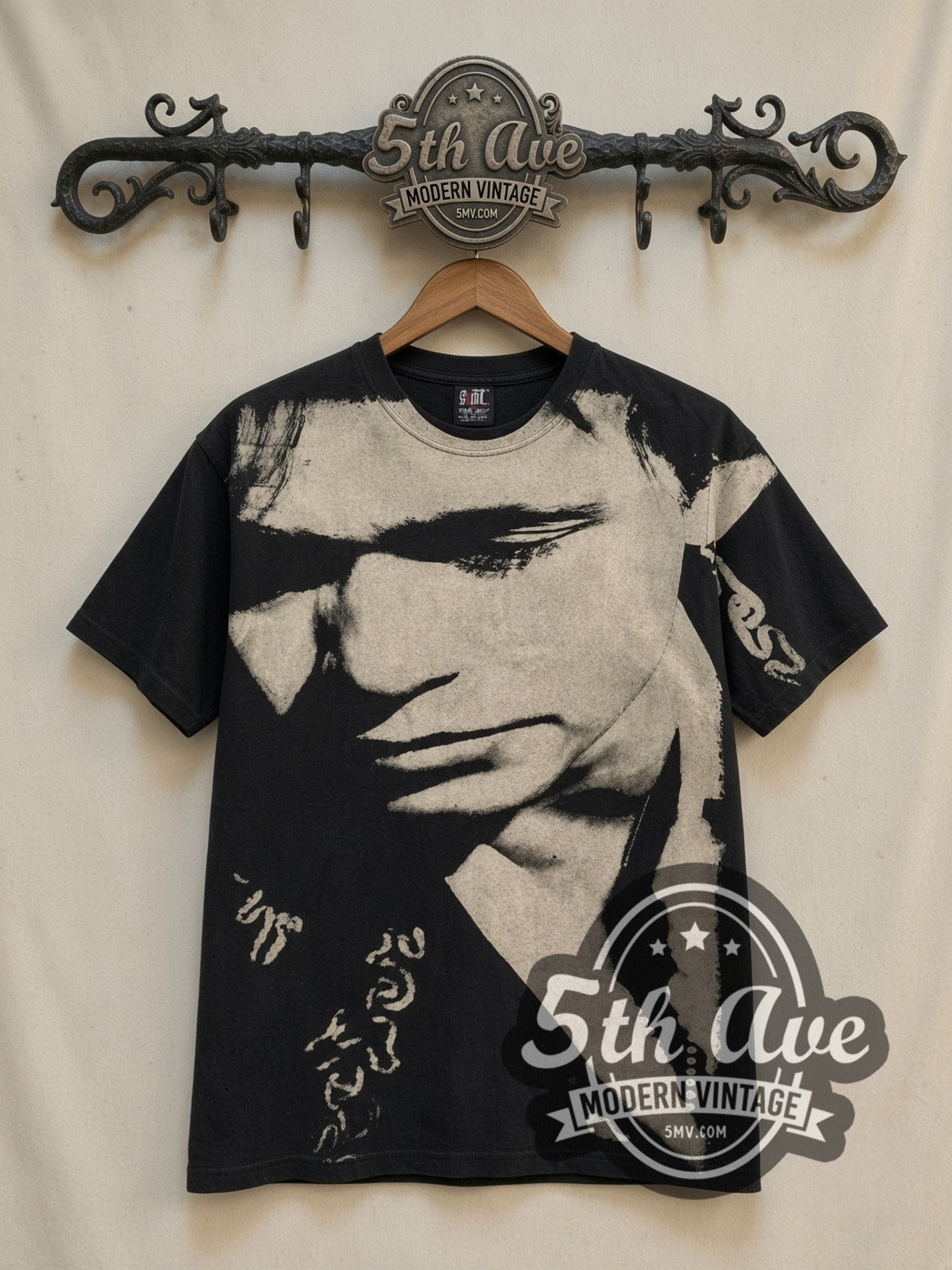 John Mellencamp Whenever We Wanted Tour 1992 all-over-print vintage band t-shirt in black, front view on a display rack