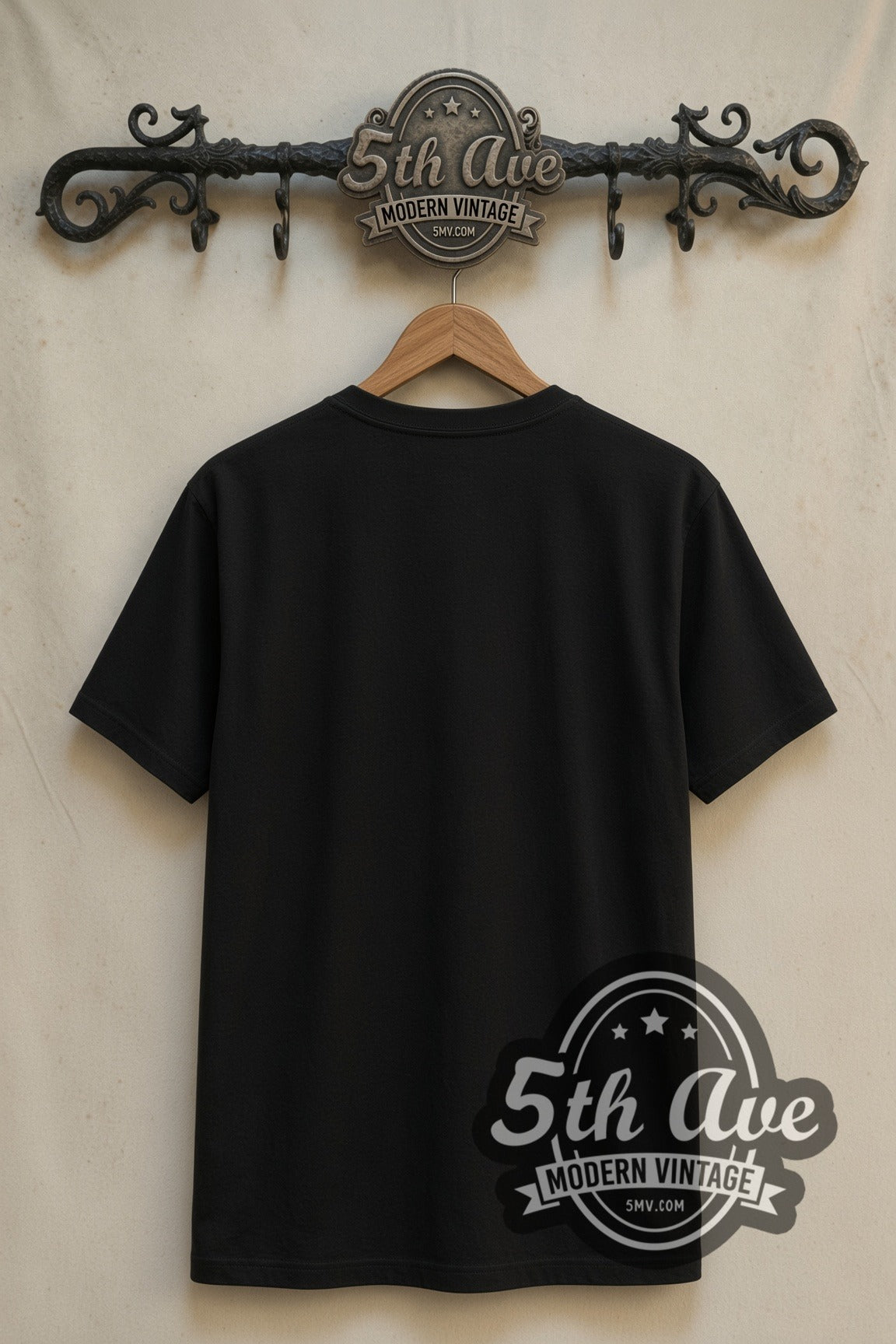 Plain black back of Joker Folie a Deux double stitched tee on rack