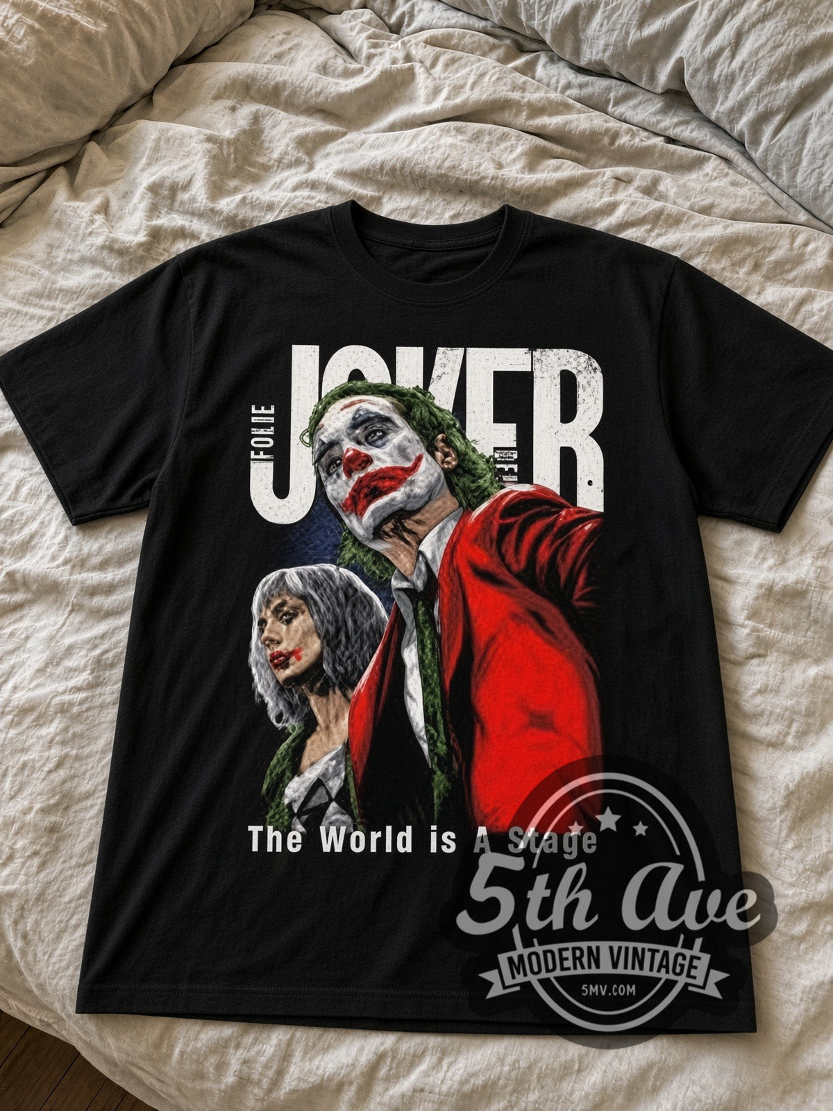 Joker Folie a Deux black graphic tee laid flat on linen bed