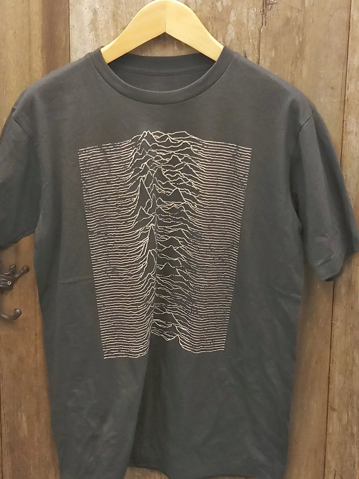 Vintage-Inspired Joy Division 'Unknown Pleasures' Graphic T-Shirt vintage band t-shirt on rack