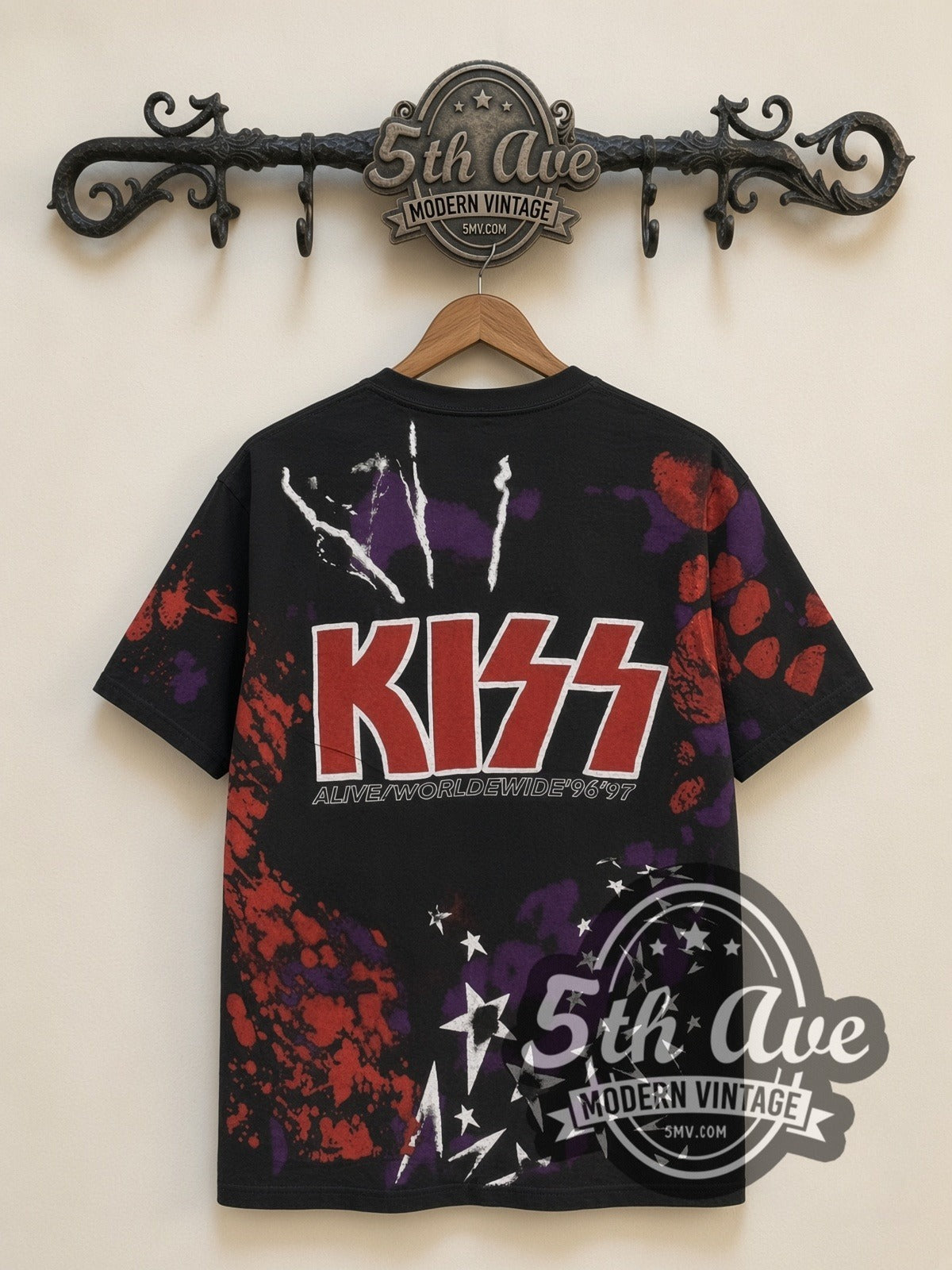 KISS Starfield Faces all-over-print vintage band t-shirt in black, back view on a display rack
