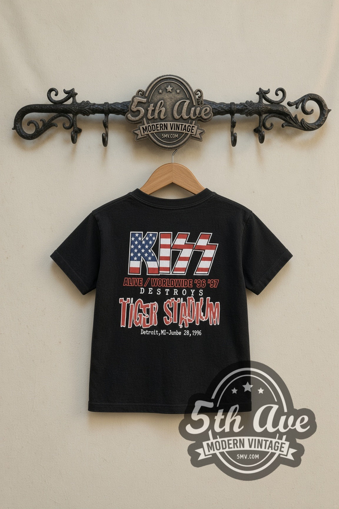 KISS Stars and Stripes Tiger Stadium kids band tee in black, back view on a display rack