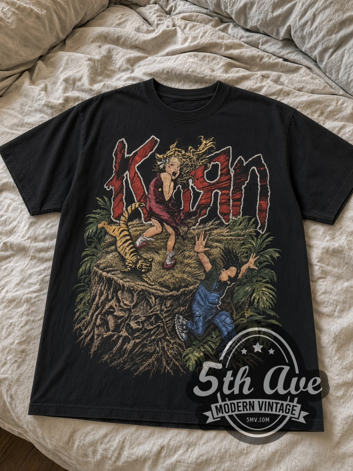Korn Girl, Tiger and Upside-Down Boy City vintage band t-shirt laid flat on bed