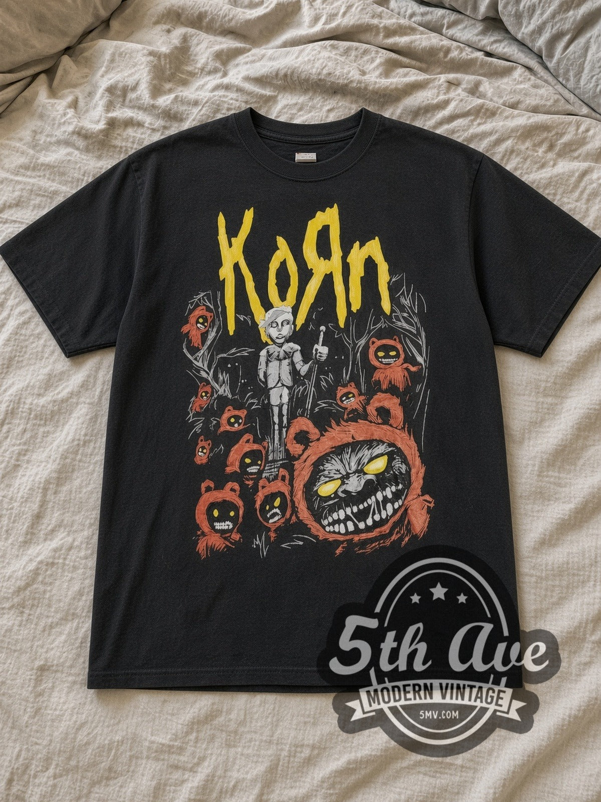Black Korn Red Bear Zombie Vintage Band T-Shirt laid flat on a linen bed