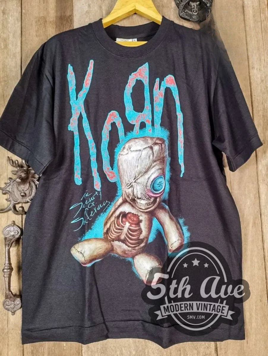Korn The Serenity of Suffering vintage band t-shirt, front view on a display rack