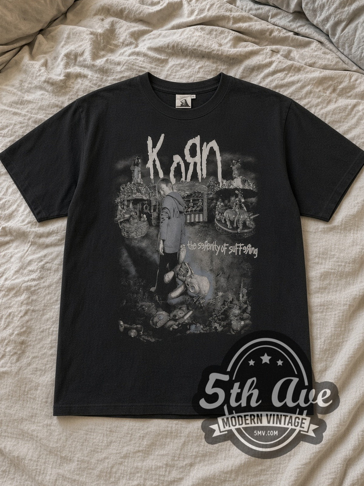 Black Korn The Serenity of Suffering Vintage Band T-Shirt laid flat on a linen bed