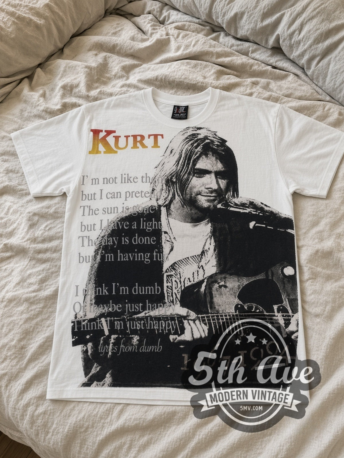 Kurt Cobain 1967-1994 Live At Last all-over-print vintage band tee laid flat