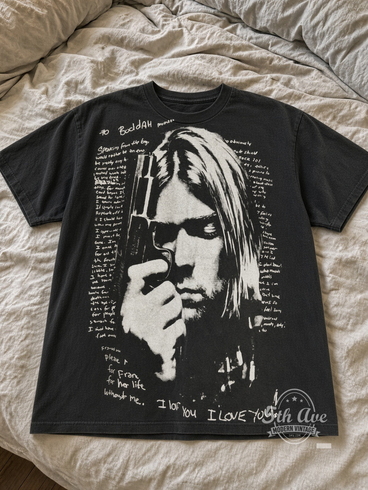 Kurt Cobain Boddah Letter Bullets 1967-1994 vintage tee laid flat on bed