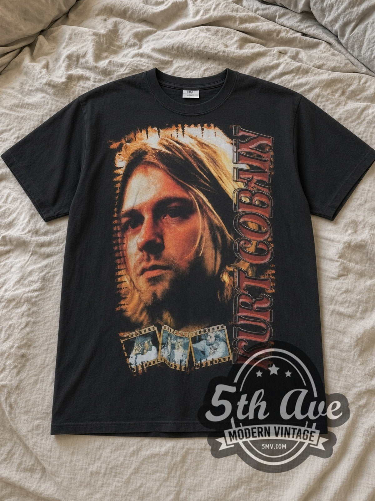 Black Nirvana Kurt Cobain Portrait with Live Stage Back Vintage Band T-Shirt laid flat on a linen bed