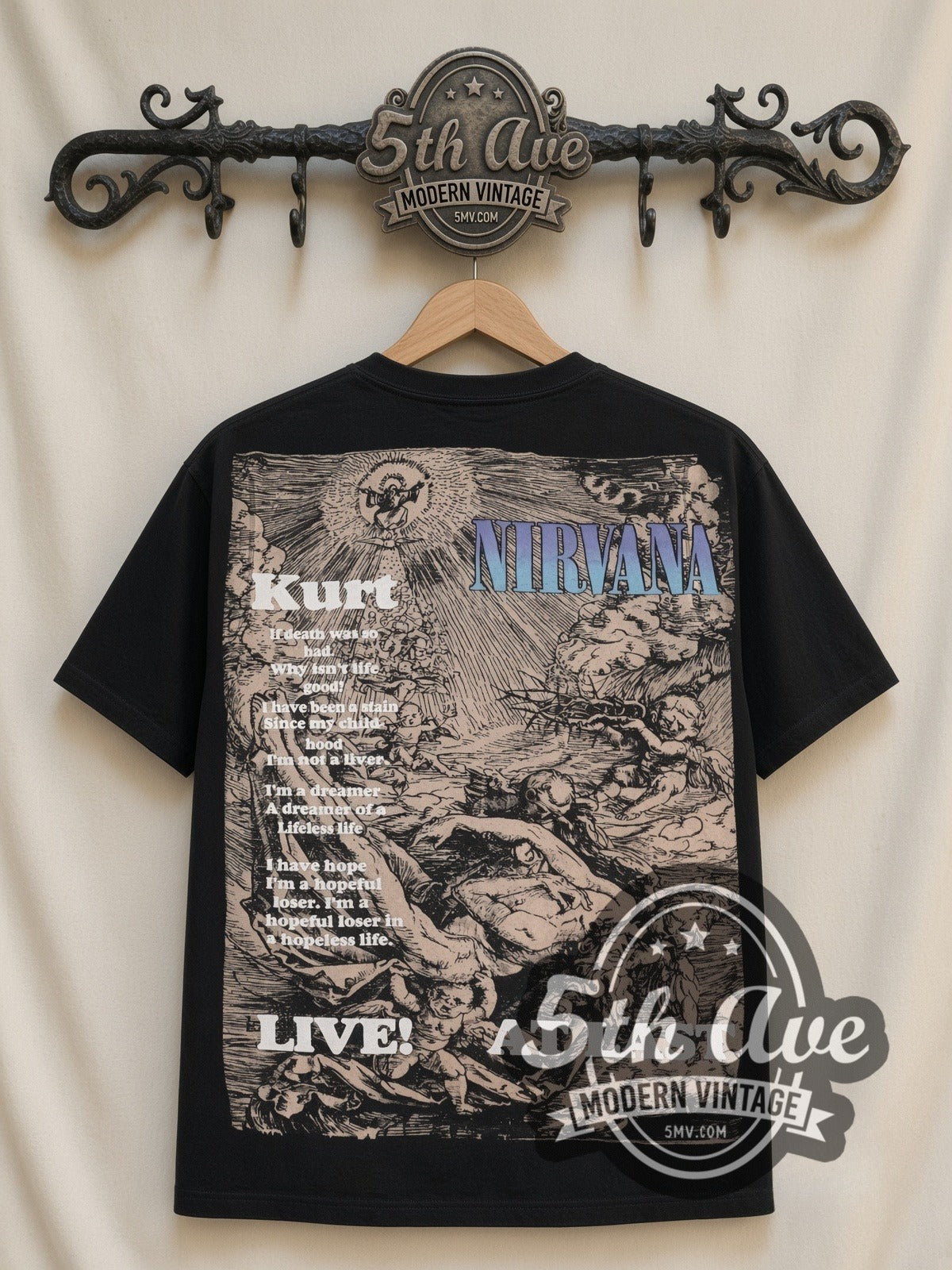 Kurt Cobain Nirvana Live At Last all-over-print vintage band tee in black, back view on a display rack