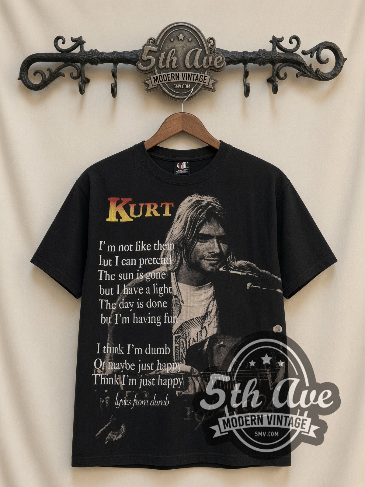 Kurt Cobain Nirvana Live At Last all-over-print vintage band tee in black, front view on a display rack