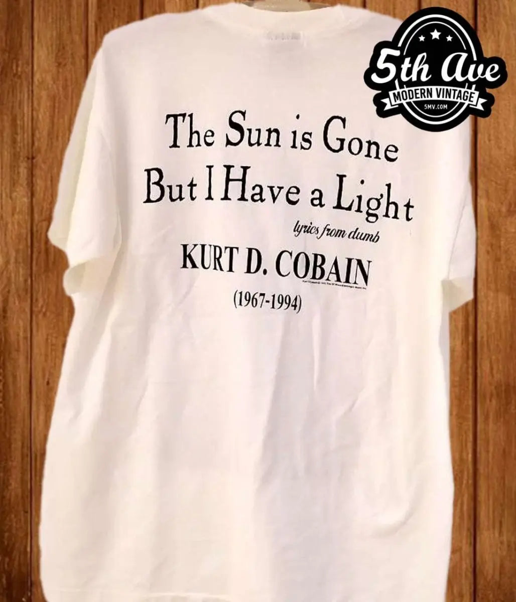 Kurt Cobain playing guitar: Nirvana t shirt with Giant Tag