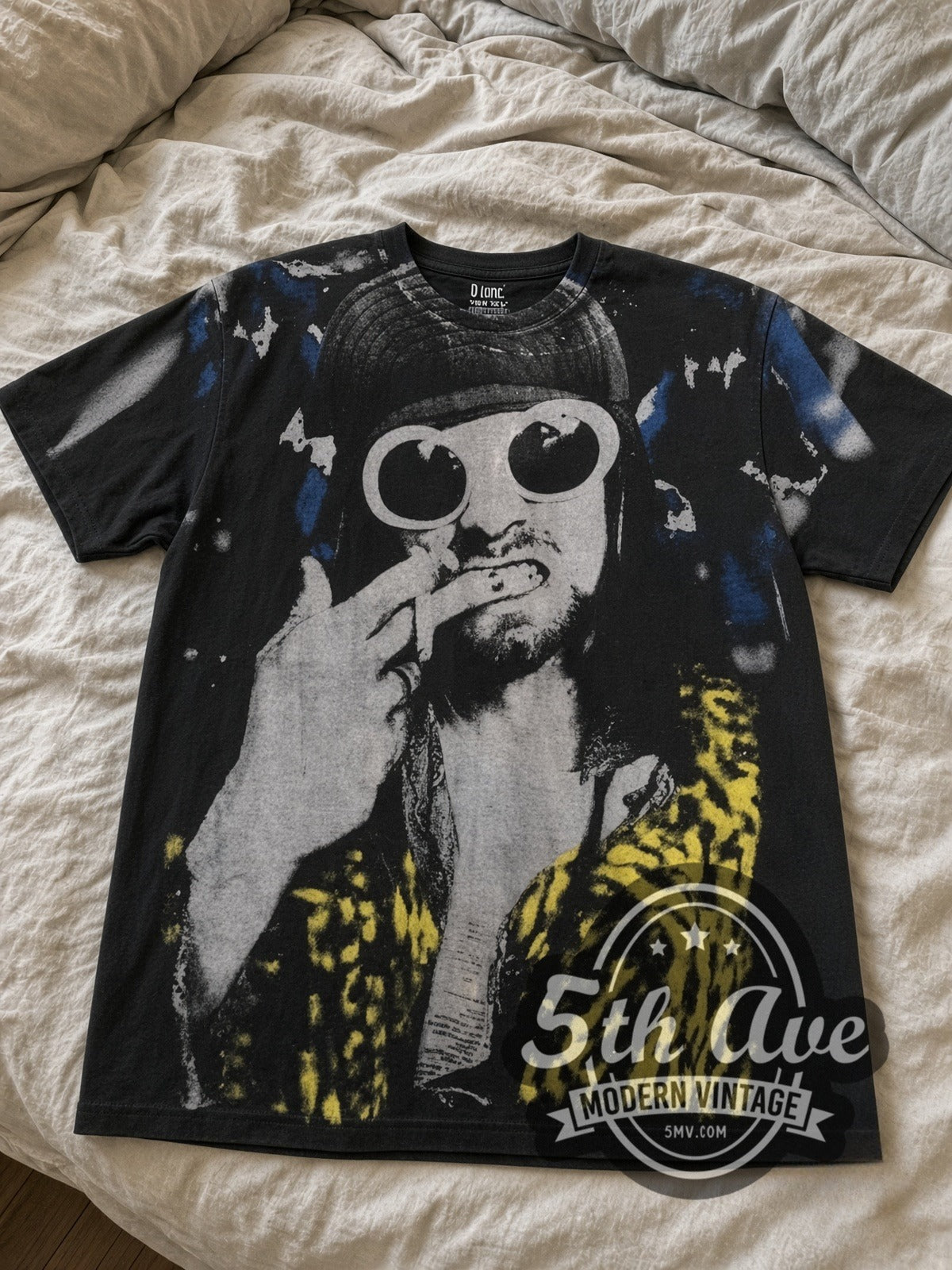 Kurt Cobain Sunglasses Leopard all-over-print vintage band tee laid flat