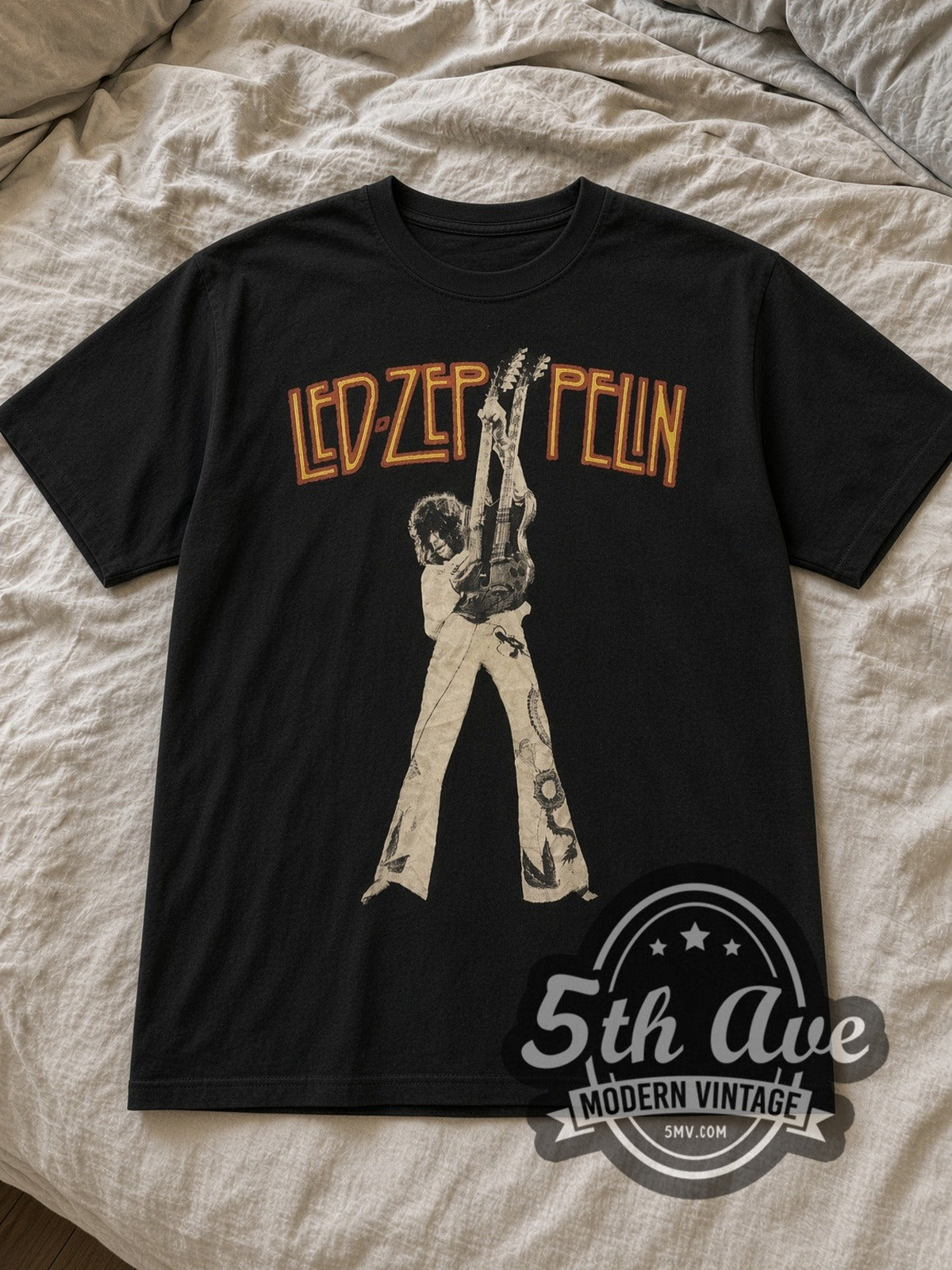 Black Led Zeppelin Jimmy Page Double Neck Vintage Band T-Shirt laid flat on a linen bed